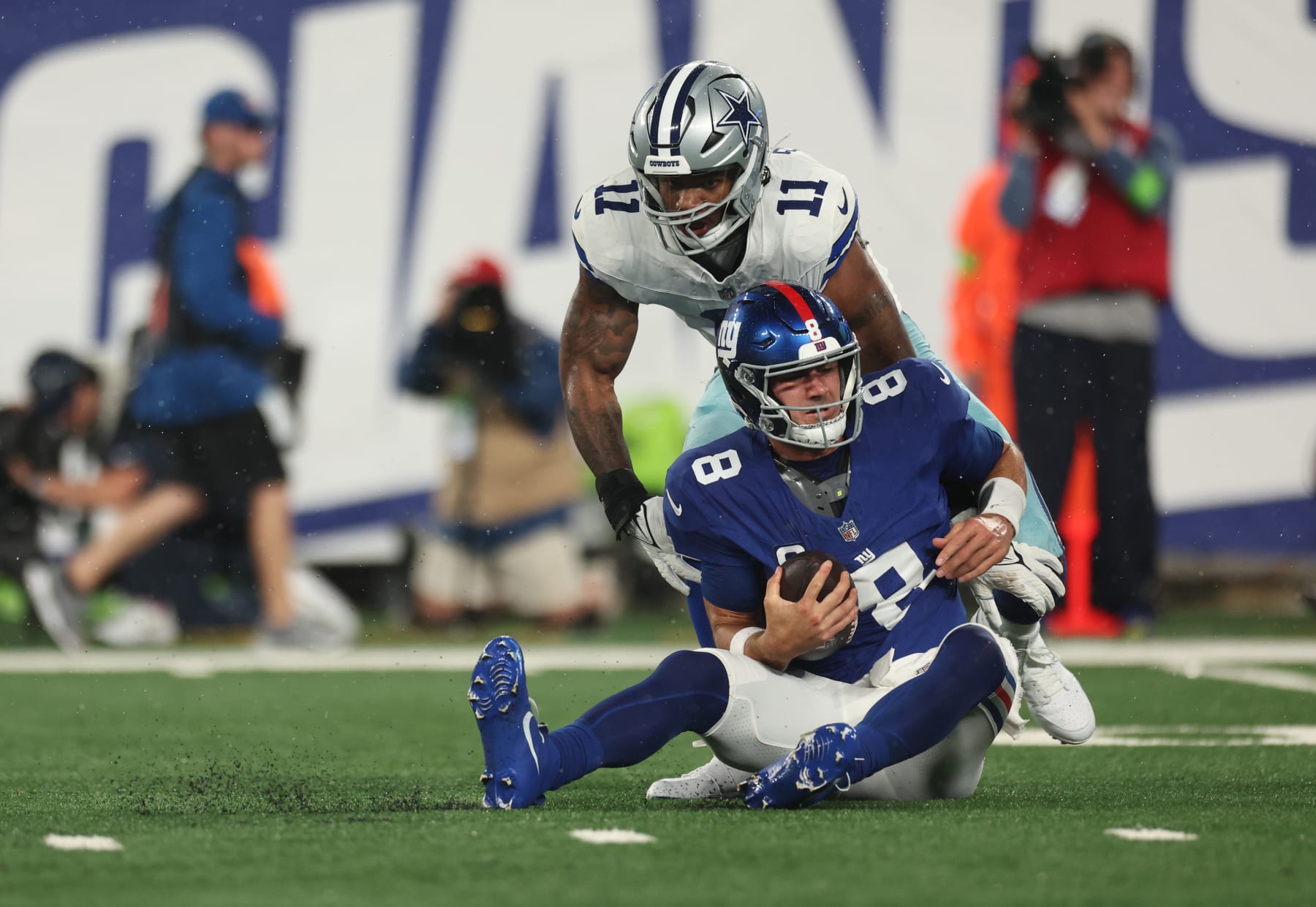 EAST RUTHERFORD, NEW JERSEY - SEPTEMBER 10: Micah Parsons #11 of the Dallas Cowboys sacks Daniel Jones #8 of the New York Giants during the first quarter at MetLife Stadium on September 10, 2023 in East Rutherford, New Jersey. (Photo by Tim Nwachukwu/Getty Images)