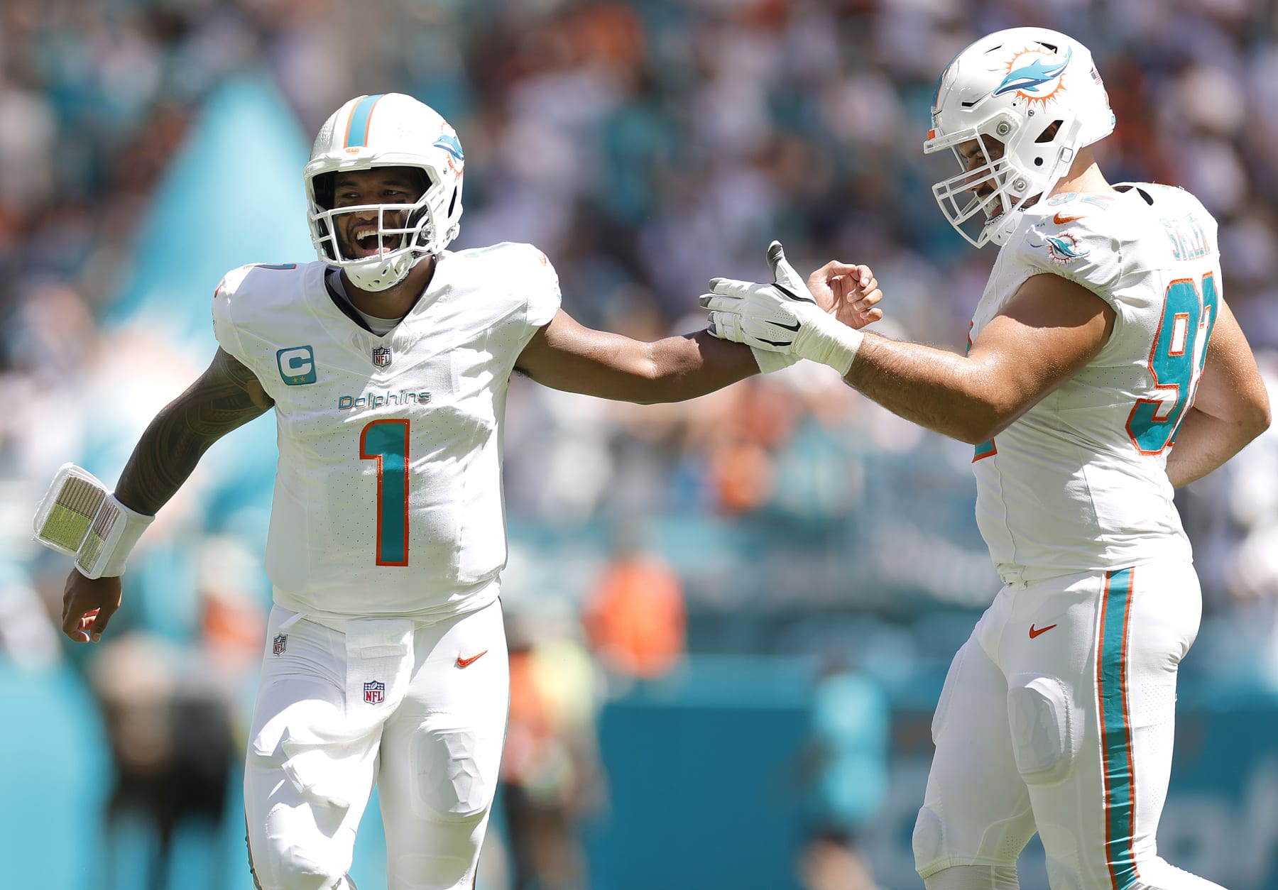 MIAMI GARDENS, FLORIDA - SEPTEMBER 24: Tua Tagovailoa #1 of the Miami Dolphins celebrates with Zach Sieler #92 of the Miami Dolphins after a Miami touchdown during the second quarter against the Denver Broncos at Hard Rock Stadium on September 24, 2023 in Miami Gardens, Florida. (Photo by Carmen Mandato/Getty Images)