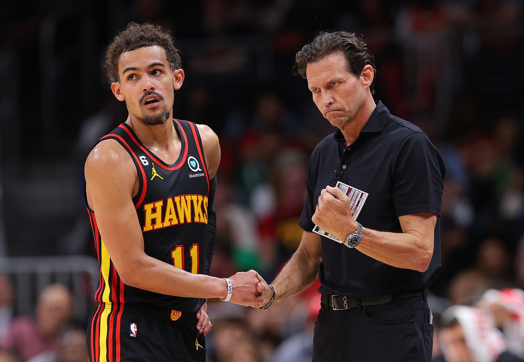 ATLANTA, GEORGIA - APRIL 21:  Head coach Quin Snyder of the Atlanta Hawks reacts with Trae Young #11 against the Boston Celtics during the fourth quarter of Game Three of the Eastern Conference First Round Playoffs at State Farm Arena on April 21, 2023 in Atlanta, Georgia.  NOTE TO USER: User expressly acknowledges and agrees that, by downloading and or using this photograph, User is consenting to the terms and conditions of the Getty Images License Agreement.  (Photo by Kevin C. Cox/Getty Images)