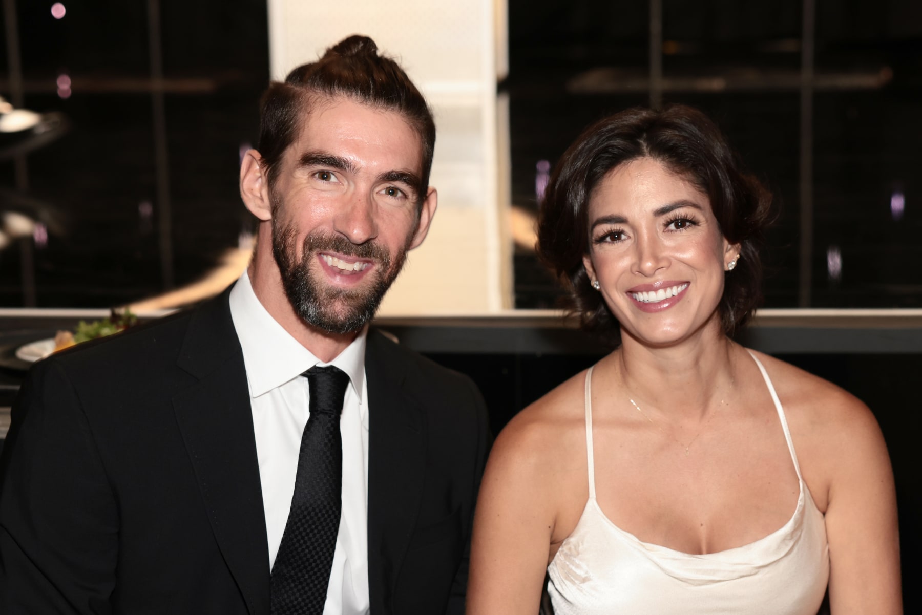 BEVERLY HILLS, CALIFORNIA - AUGUST 18: (L-R) Michael Phelps and Nicole Johnson attend the Harold & Carole Pump Foundation 2023 Gala at The Beverly Hilton on August 18, 2023 in Beverly Hills, California. (Photo by Tiffany Rose/Getty Images for Harold & Carole Pump Foundation)