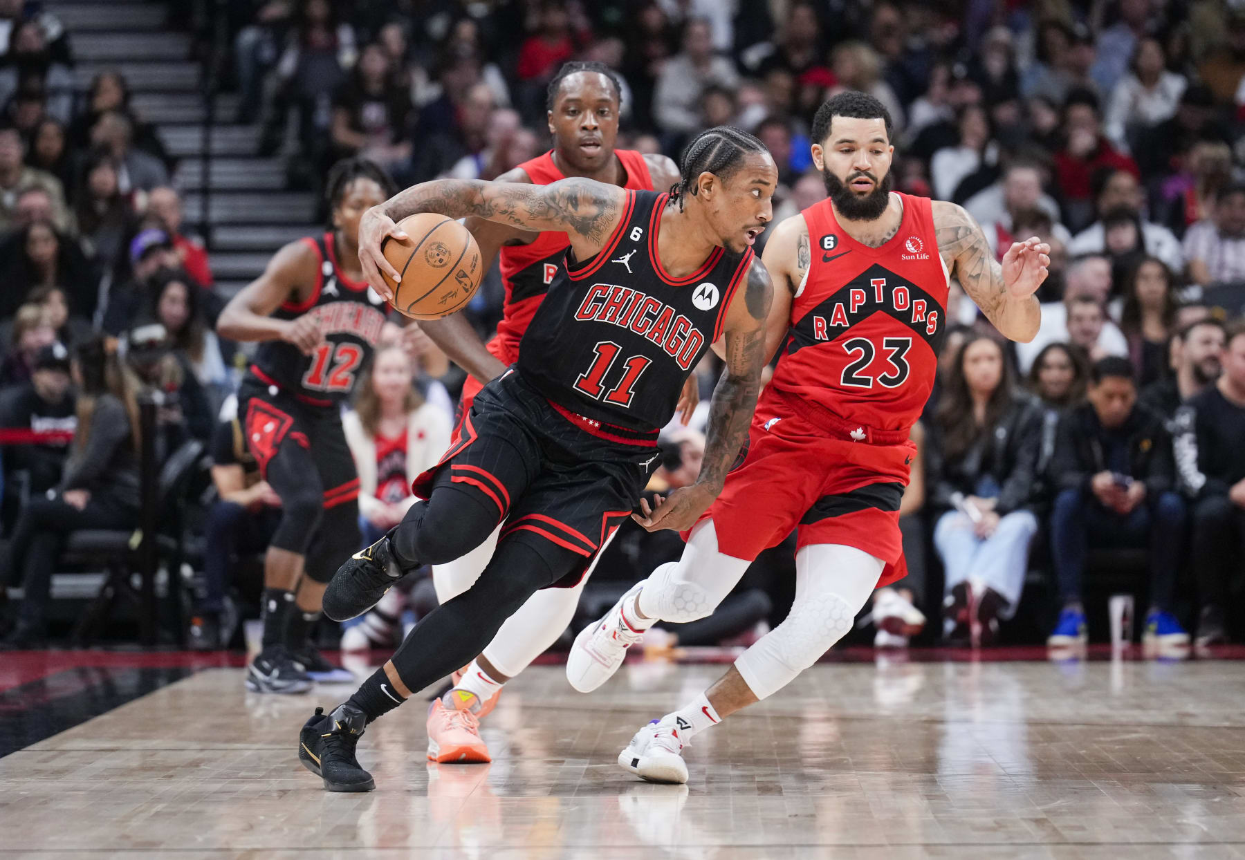 TORONTO, ON - NOVEMBER 6: DeMar DeRozan #11 of the Chicago Bulls drives against Fred VanVleet #23 of the Toronto Raptors during the first half of their basketball game at the Scotiabank Arena on November 6, 2022 in Toronto, Ontario, Canada. NOTE TO USER: User expressly acknowledges and agrees that, by downloading and/or using this Photograph, user is consenting to the terms and conditions of the Getty Images License Agreement. (Photo by Mark Blinch/Getty Images)