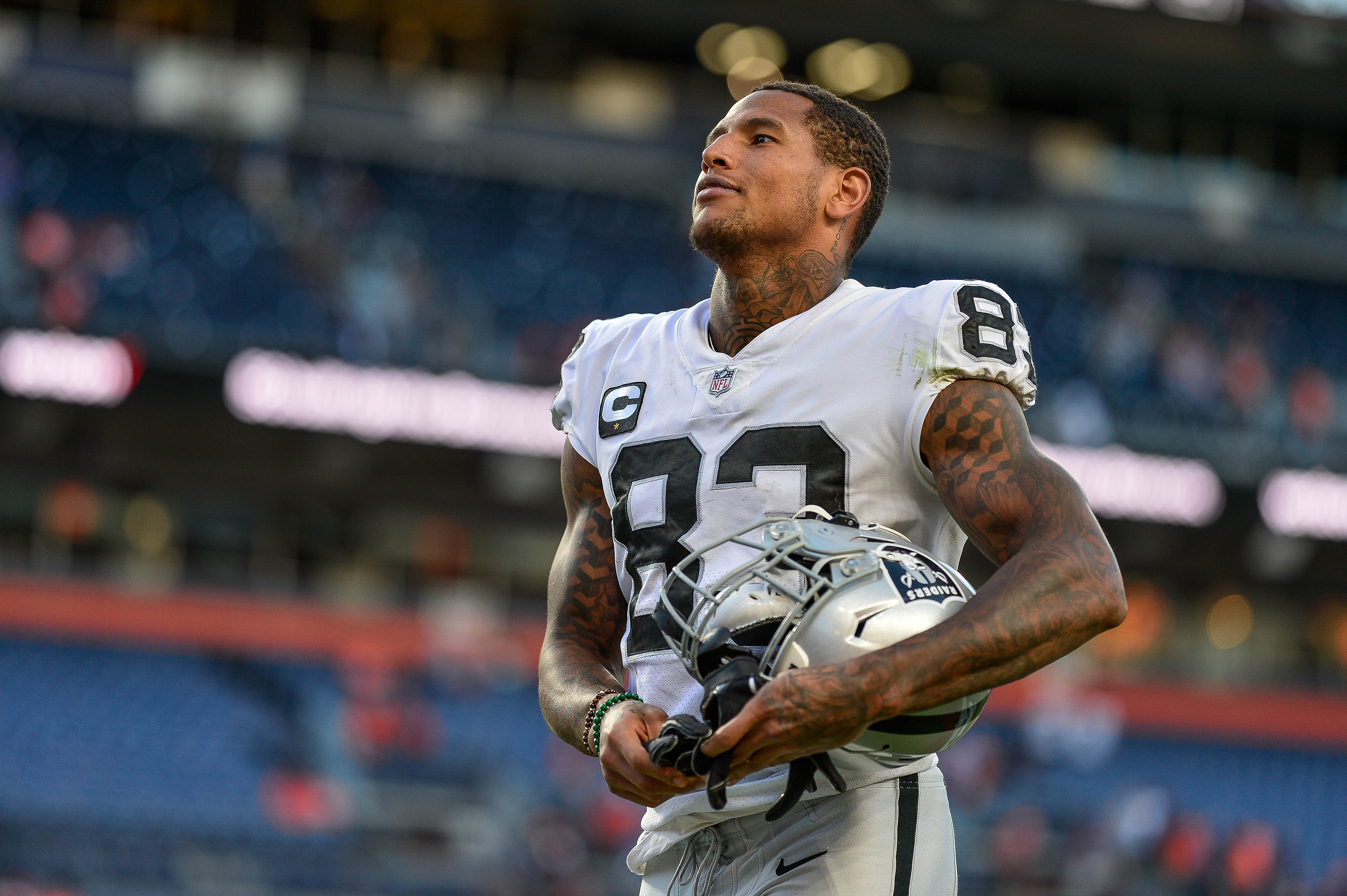 DENVER, CO - OCTOBER 17:  Darren Waller #83 of the Las Vegas Raiders walks off the field after a win over the Denver Broncos at Empower Field at Mile High on October 17, 2021 in Denver, Colorado. (Photo by Dustin Bradford/Getty Images)