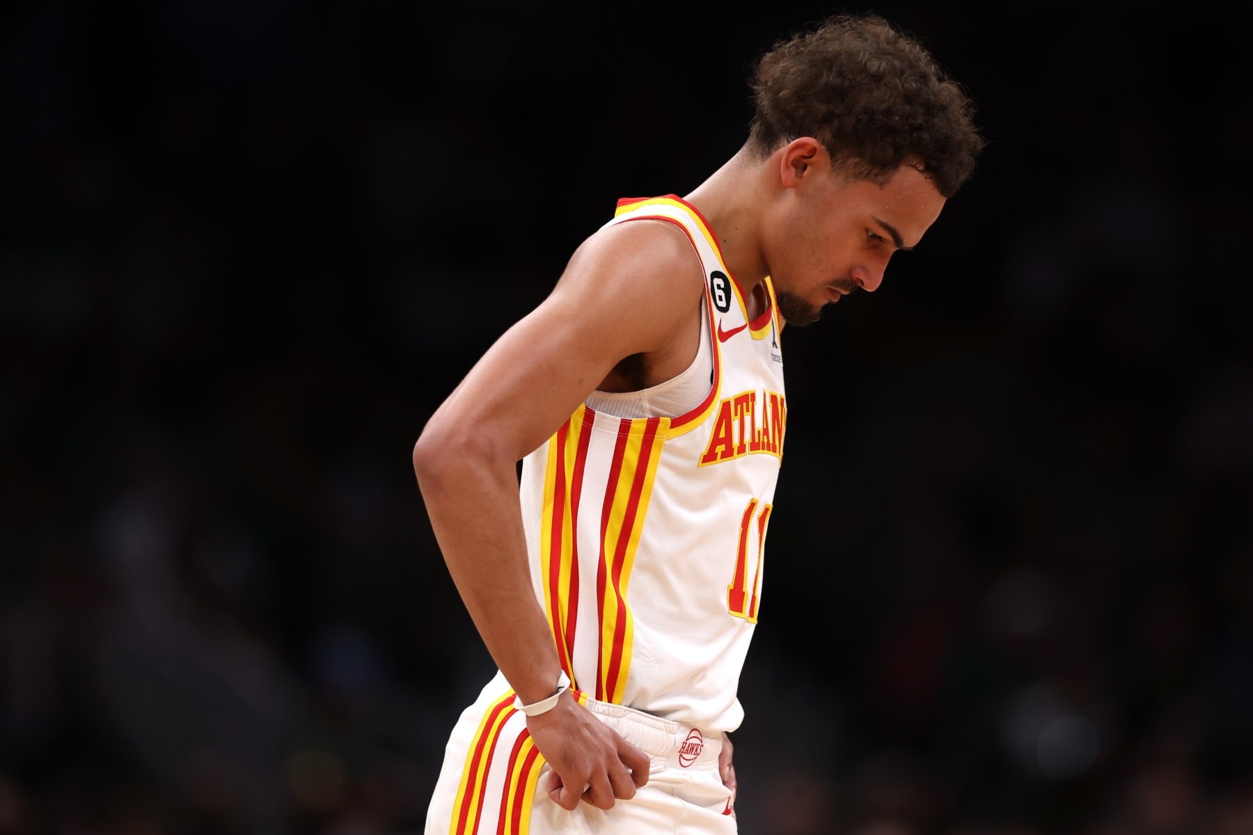 BOSTON, MASSACHUSETTS - APRIL 15: Trae Young #11 of the Atlanta Hawks looks on during the second quarter of Game One of the Eastern Conference First Round Playoffs between the Boston Celtics and the Atlanta Hawks at TD Garden on April 15, 2023 in Boston, Massachusetts. NOTE TO USER: User expressly acknowledges and agrees that, by downloading and or using this photograph, User is consenting to the terms and conditions of the Getty Images License Agreement.  (Photo by Maddie Meyer/Getty Images)