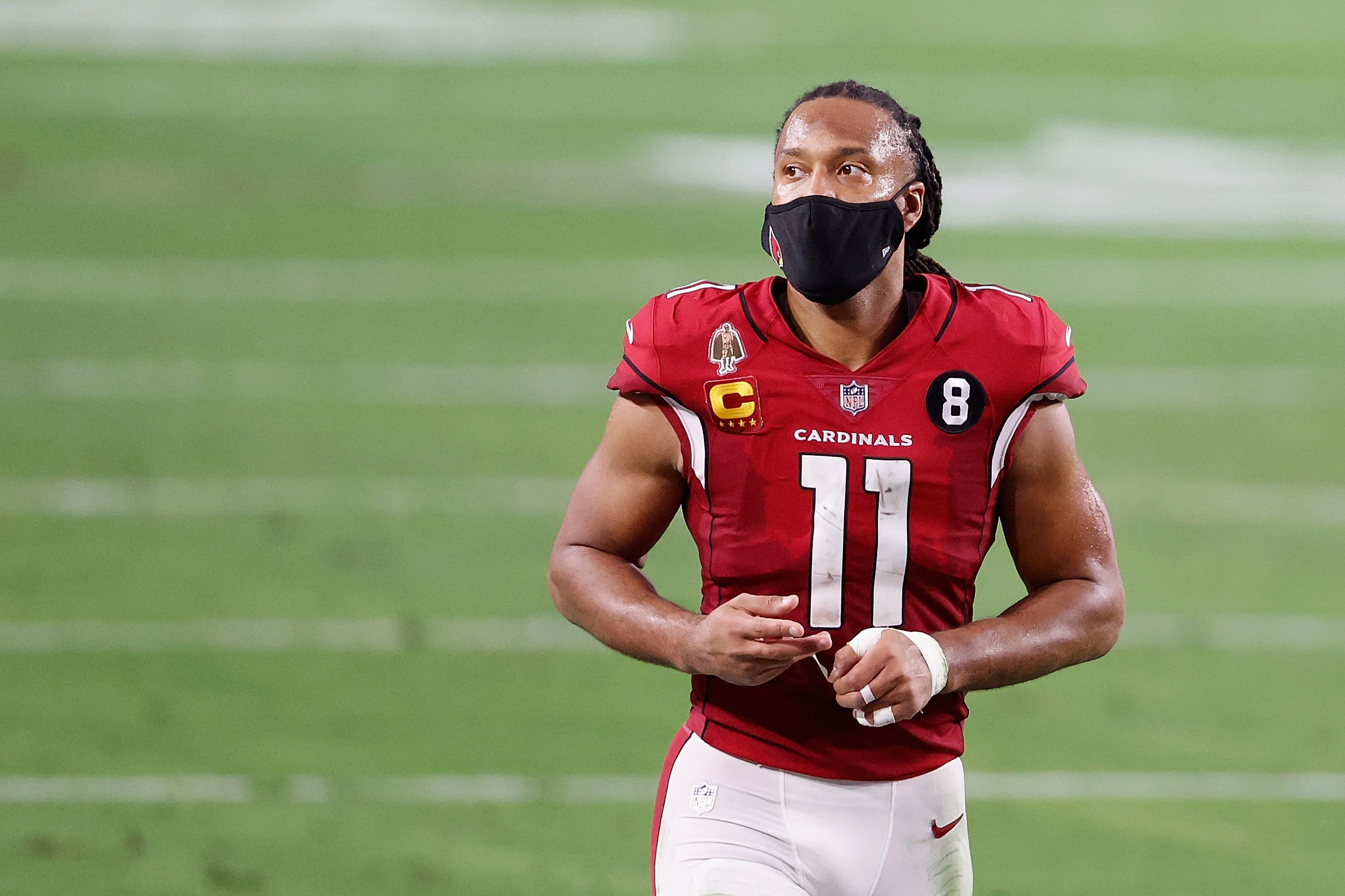 GLENDALE, ARIZONA - DECEMBER 26: Wide receiver Larry Fitzgerald #11 of the Arizona Cardinals reacts to fans as he walks off the field following the NFL game against the San Francisco 49ers at State Farm Stadium on December 26, 2020 in Glendale, Arizona. The 49ers defeated the Cardinals 20-12. (Photo by Christian Petersen/Getty Images)