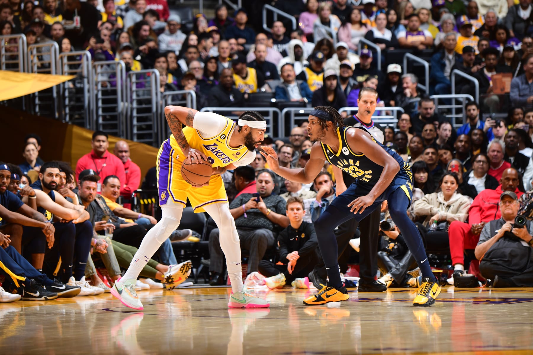 LOS ANGELES, CA - NOVEMBER 28: Anthony Davis #3 of the Los Angeles Lakers handles the ball while being defended by Myles Turner #33 of the Indiana Pacers during the game on November 28, 2022 at Crypto.Com Arena in Los Angeles, California. NOTE TO USER: User expressly acknowledges and agrees that, by downloading and/or using this Photograph, user is consenting to the terms and conditions of the Getty Images License Agreement. Mandatory Copyright Notice: Copyright 2022 NBAE (Photo by Adam Pantozzi/NBAE via Getty Images)