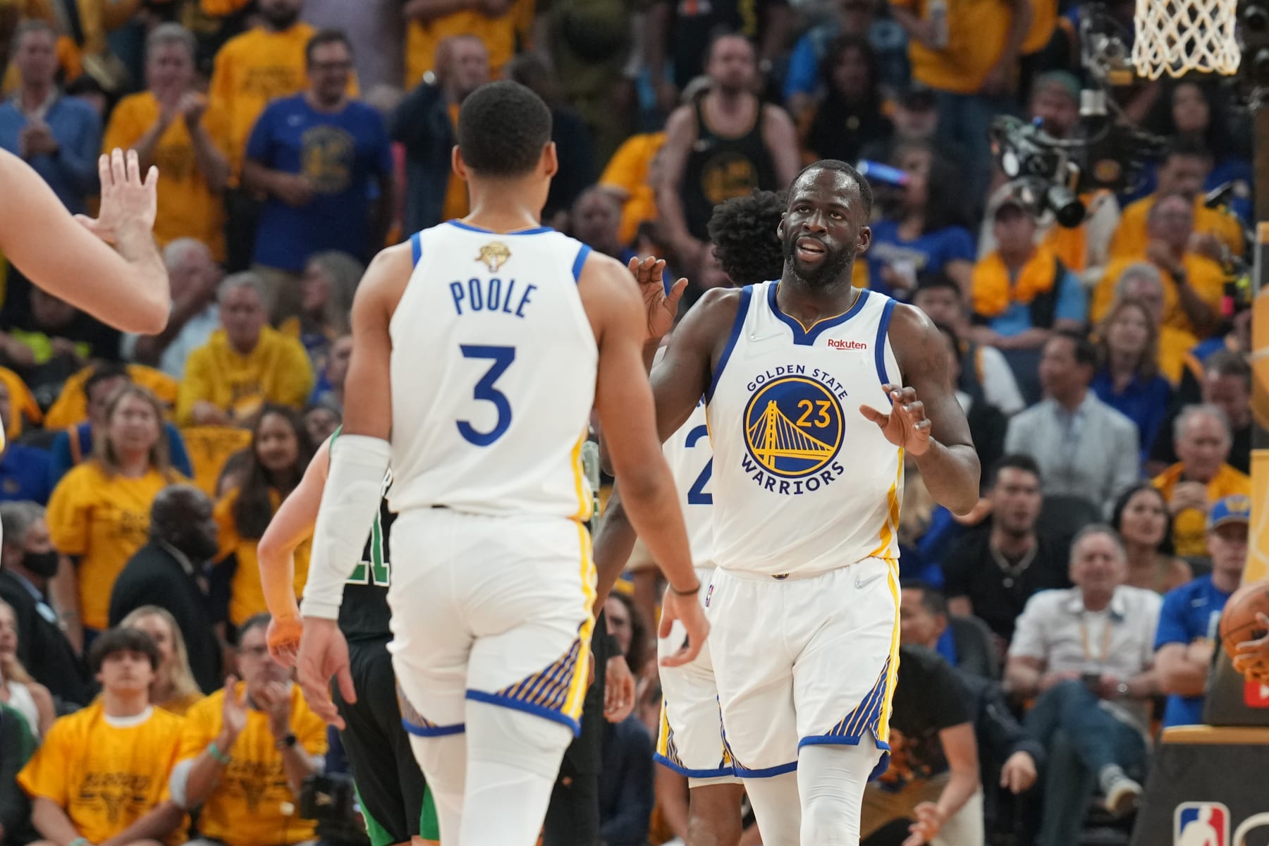 SAN FRANCISCO, CA - JUNE 13: Draymond Green #23 hi-fives Jordan Poole #3 of the Golden State Warriors during Game Five of the 2022 NBA Finals on June 13, 2022 at Chase Center in San Francisco, California. NOTE TO USER: User expressly acknowledges and agrees that, by downloading and or using this photograph, user is consenting to the terms and conditions of Getty Images License Agreement. Mandatory Copyright Notice: Copyright 2022 NBAE (Photo by Jesse D. Garrabrant/NBAE via Getty Images)