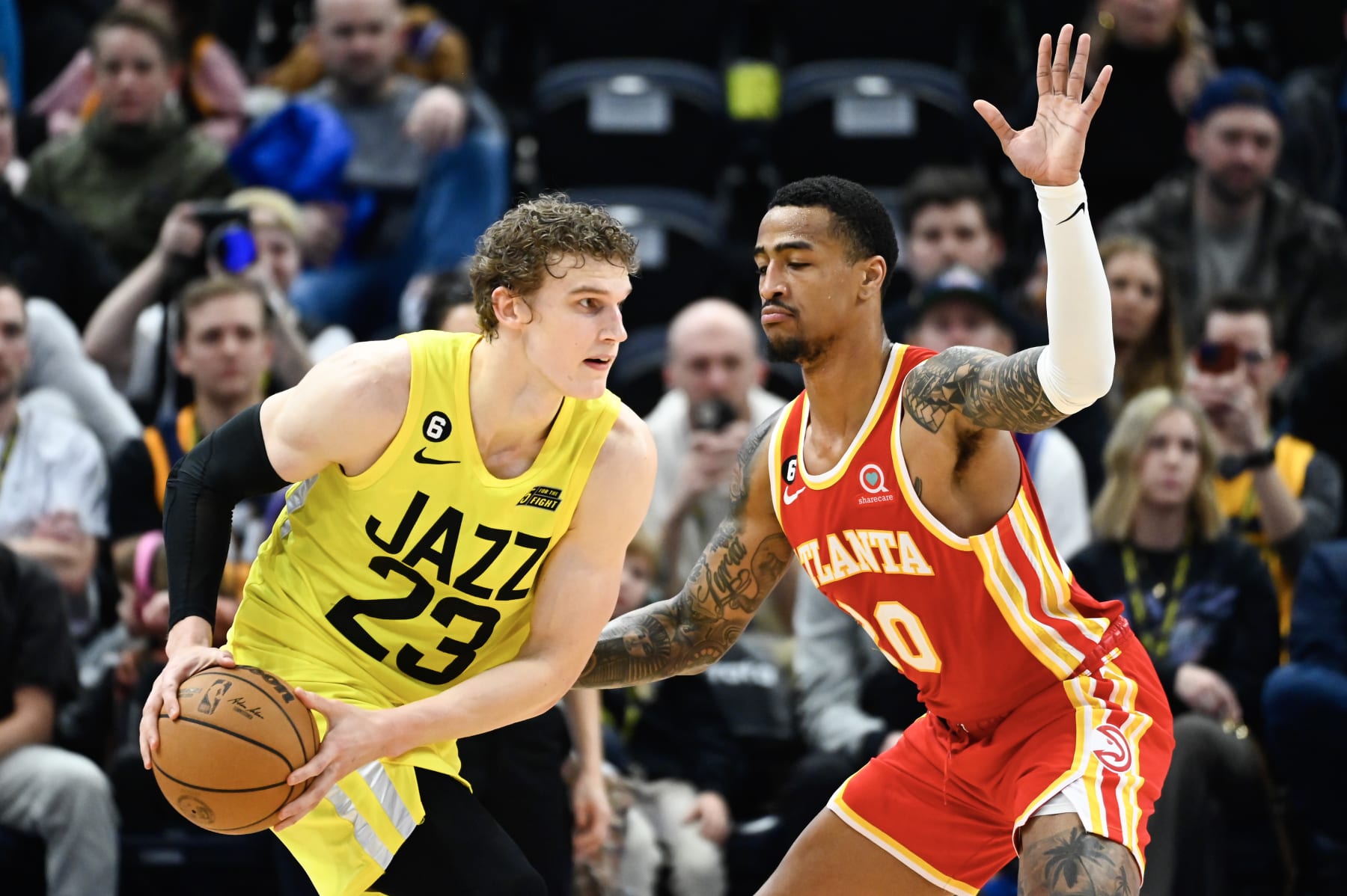 SALT LAKE CITY, UTAH - FEBRUARY 03: Lauri Markkanen #23 of the Utah Jazz looks past John Collins #20 of the Atlanta Hawks during the second half of a game at Vivint Arena on February 03, 2023 in Salt Lake City, Utah.  NOTE TO USER: User expressly acknowledges and agrees that, by downloading and or using this photograph, User is consenting to the terms and conditions of the Getty Images License Agreement. (Photo by Alex Goodlett/Getty Images)