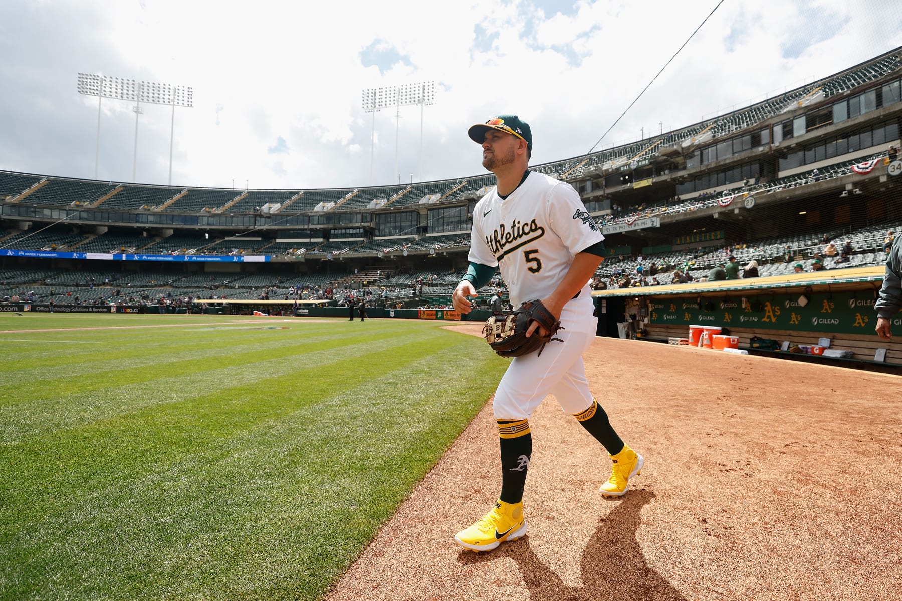 OAKLAND, CALIFORNIA - MARCH 30: J.D. Davis #5 of the Oakland Athletics walks to the field before the game against the Cleveland Guardians at Oakland Coliseum on March 30, 2024 in Oakland, California. (Photo by Lachlan Cunningham/Getty Images)
