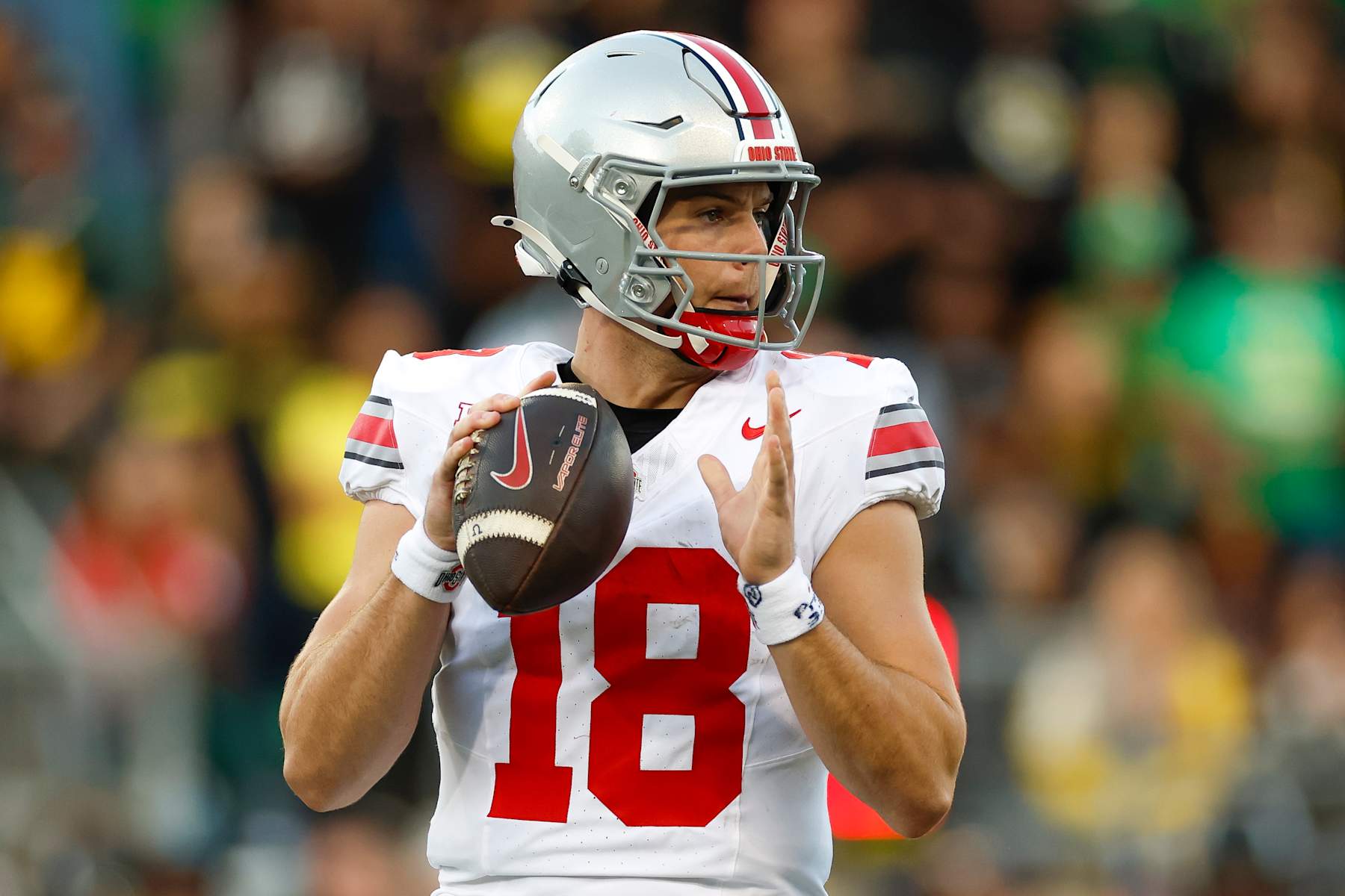 EUGENE, OREGON - OCTOBER 12: Will Howard #18 of the Ohio State Buckeyes drops back to pass during the first half against the Oregon Ducks at Autzen Stadium on October 12, 2024 in Eugene, Oregon. (Photo by Brandon Sloter/Image Of Sport/Getty Images)