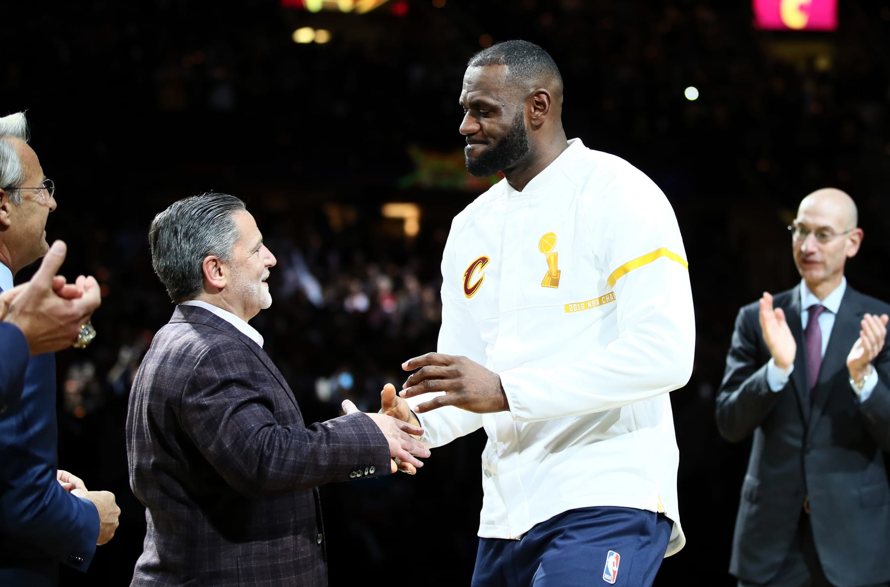 CLEVELAND, OH - OCTOBER 25: LeBron James #23 of the Cleveland Cavaliers recieves his championship ring from owner Dan Gilbert before the game against the New York Knicks at Quicken Loans Arena on October 25, 2016 in Cleveland, Ohio.   NOTE TO USER: User expressly acknowledges and agrees that, by downloading and or using this photograph, User is consenting to the terms and conditions of the Getty Images License Agreement. (Photo by Ezra Shaw/Getty Images)