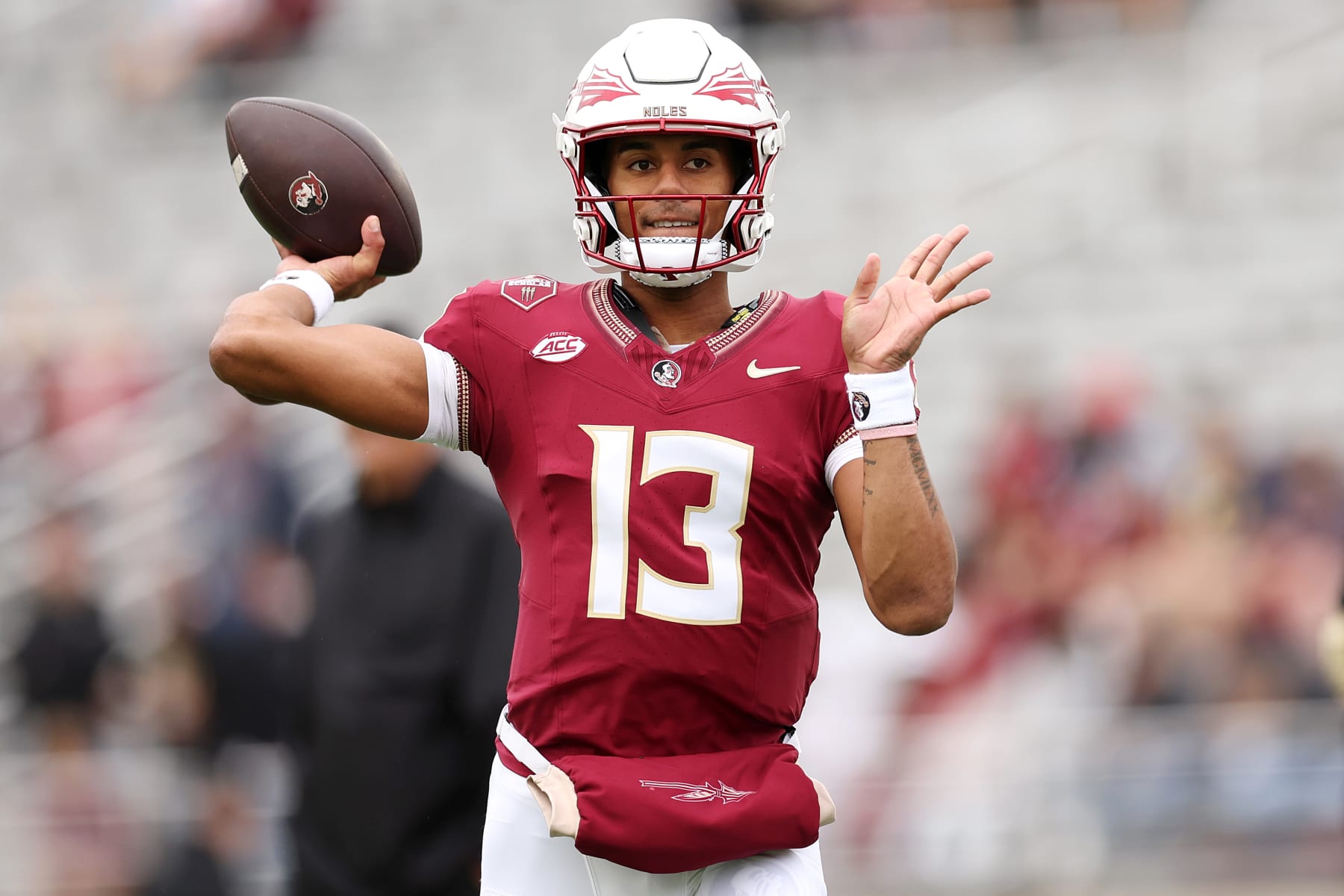 CHESTNUT HILL, MASSACHUSETTS - SEPTEMBER 16: Jordan Travis #13 of the Florida State Seminoles warms up before the game between the Florida State Seminoles and the Boston College Eagles at Alumni Stadium on September 16, 2023 in Chestnut Hill, Massachusetts. (Photo by Maddie Meyer/Getty Images)