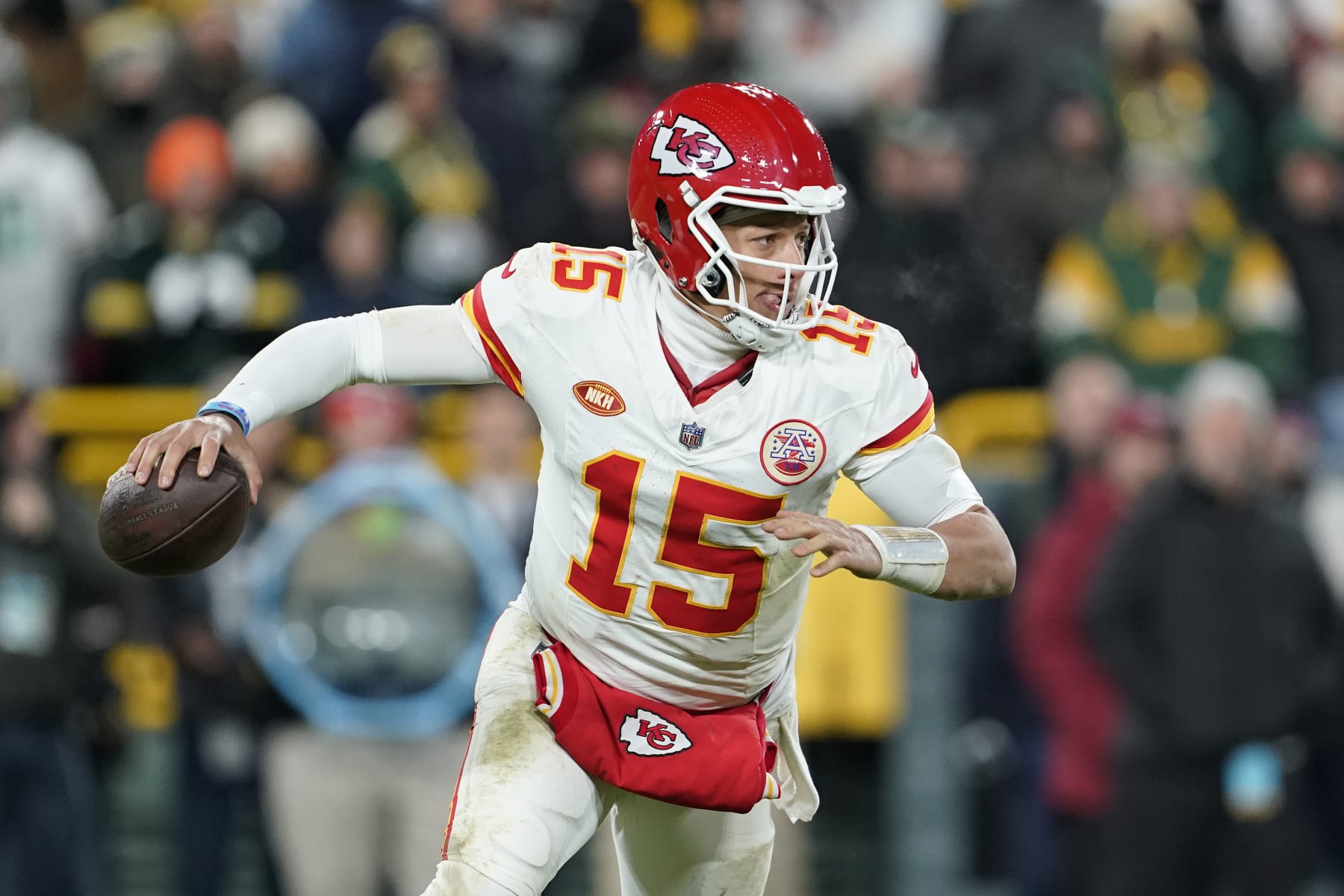 GREEN BAY, WISCONSIN - DECEMBER 03: Patrick Mahomes #15 of the Kansas City Chiefs scrambles with the ball in the second half against the Green Bay Packers at Lambeau Field on December 03, 2023 in Green Bay, Wisconsin. (Photo by Patrick McDermott/Getty Images)