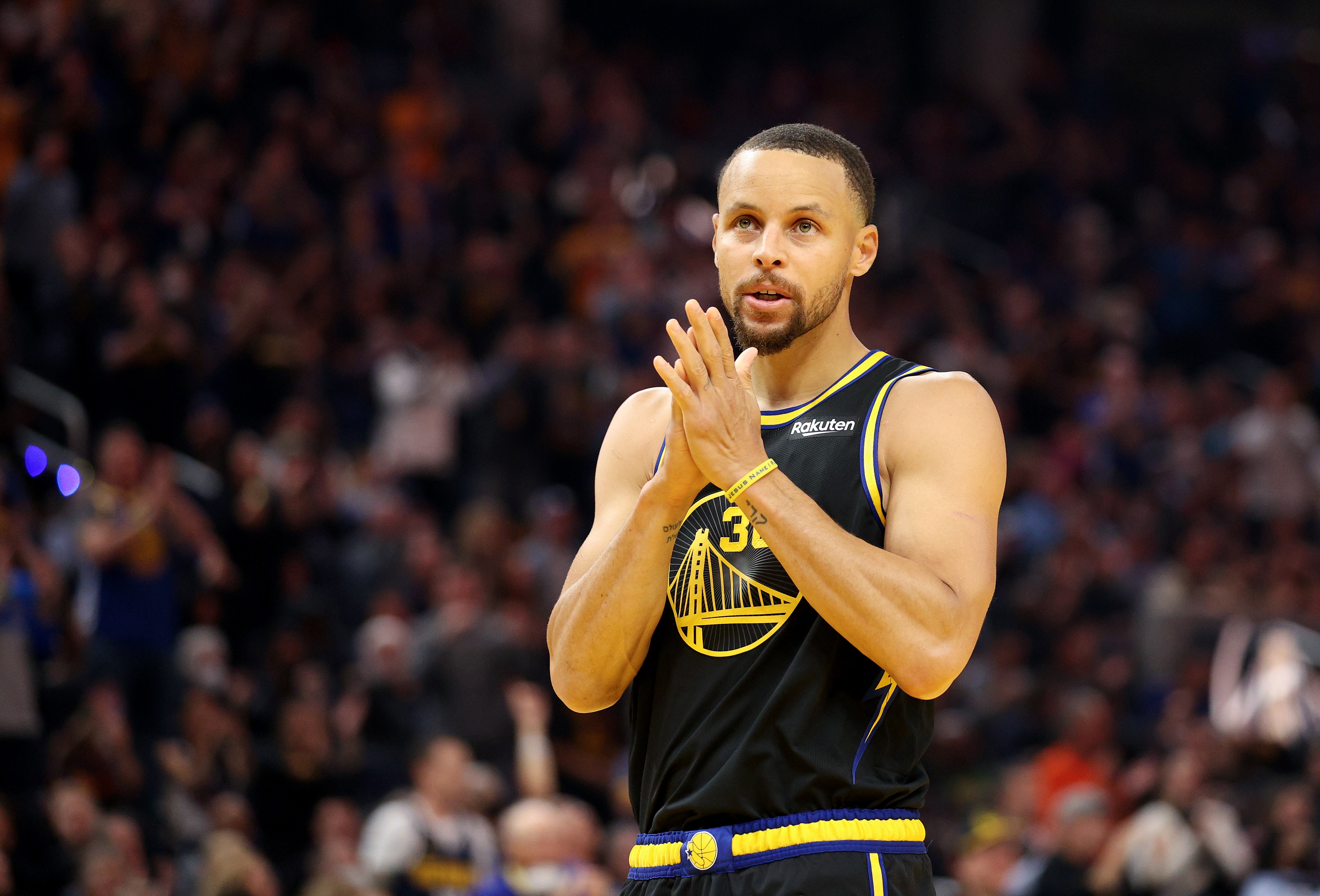 SAN FRANCISCO, CALIFORNIA - APRIL 16: Stephen Curry #30 of the Golden State Warriors enters the game in the first quarter against the Denver Nuggets during Game One of the Western Conference First Round NBA Playoffs at Chase Center on April 16, 2022 in San Francisco, California. NOTE TO USER: User expressly acknowledges and agrees that, by downloading and/or using this photograph, User is consenting to the terms and conditions of the Getty Images License Agreement.  (Photo by Ezra Shaw/Getty Images)