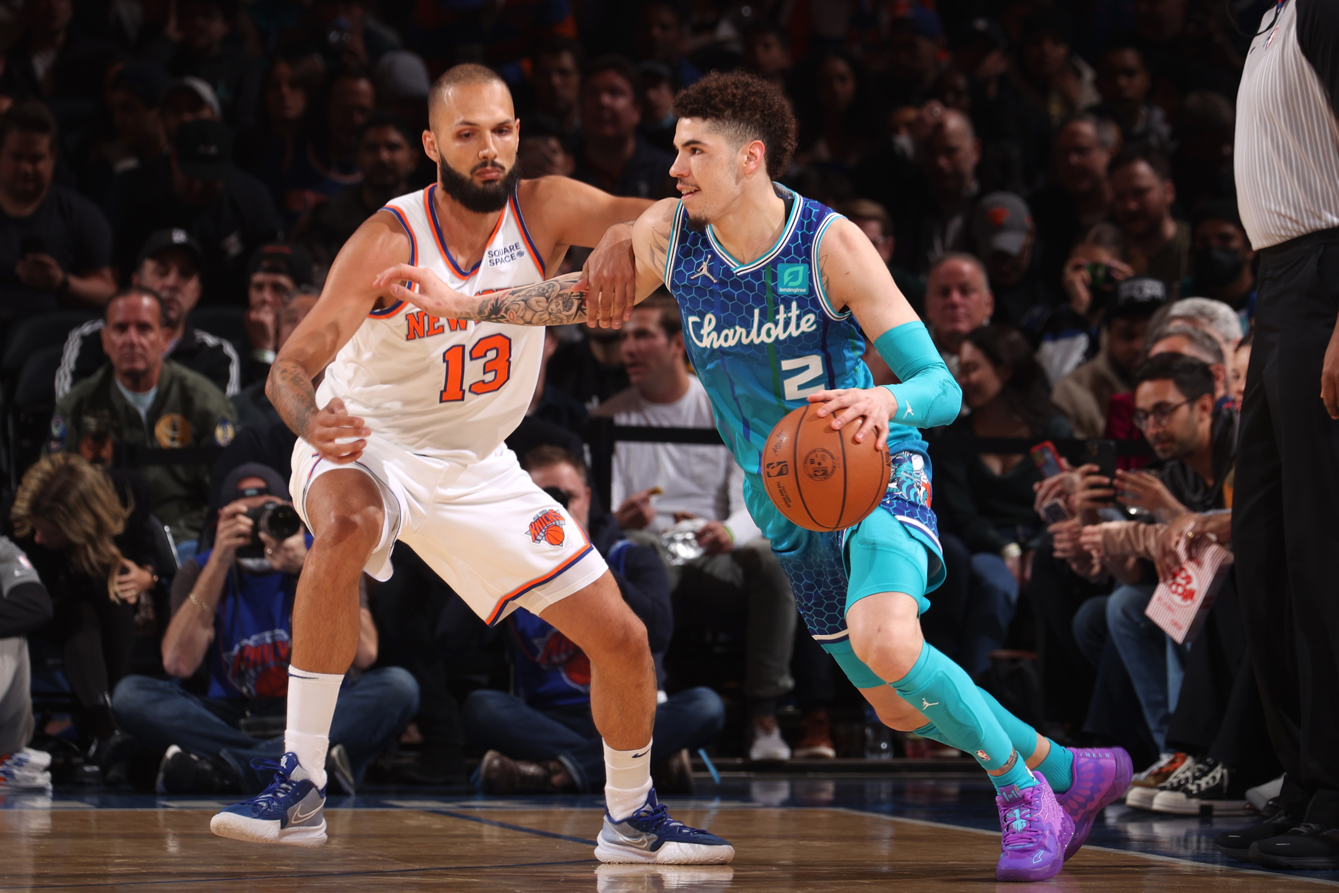 NEW YORK, NY - MARCH 30: Evan Fournier #13 of the New York Knicks plays defense on LaMelo Ball #2 of the Charlotte Hornets during the game on March 30, 2022 at Madison Square Garden in New York City, New York.  NOTE TO USER: User expressly acknowledges and agrees that, by downloading and or using this photograph, User is consenting to the terms and conditions of the Getty Images License Agreement. Mandatory Copyright Notice: Copyright 2022 NBAE  (Photo by Nathaniel S. Butler/NBAE via Getty Images)