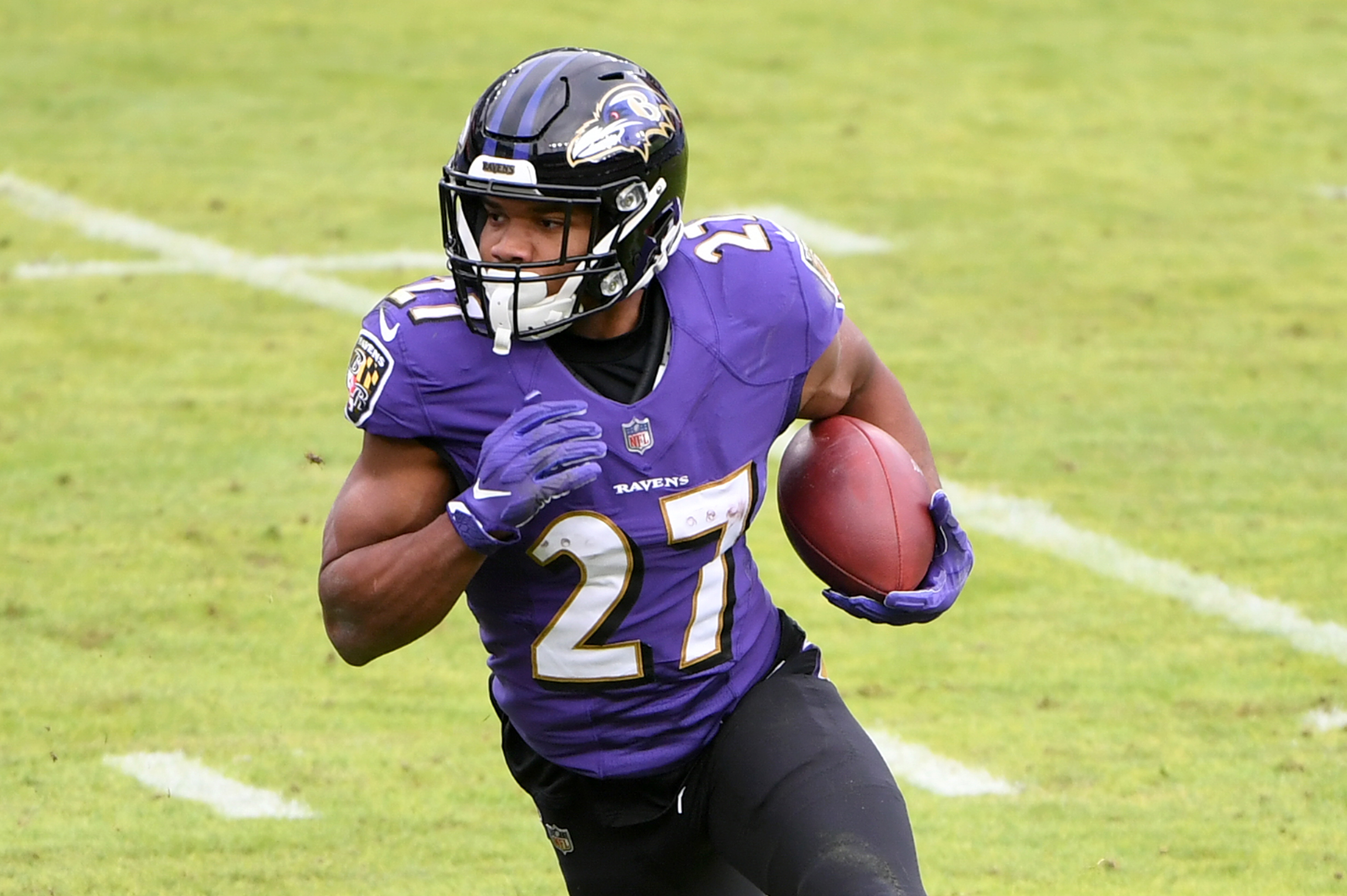 BALTIMORE, MARYLAND - DECEMBER 20: Running back J.K. Dobbins #27 of the Baltimore Ravens runs against the Jacksonville Jaguars during the first half at M&T Bank Stadium on December 20, 2020 in Baltimore, Maryland. (Photo by Will Newton/Getty Images)
