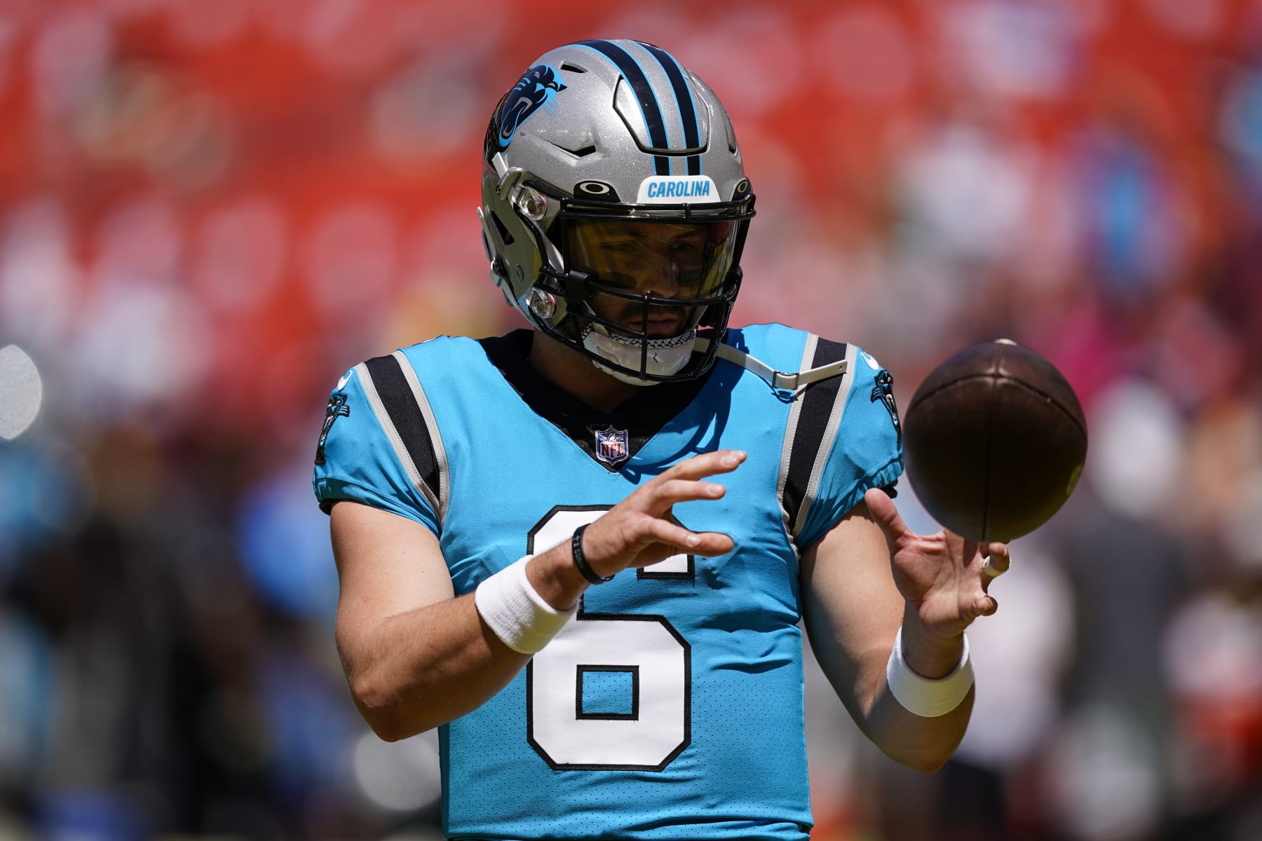 Carolina Panthers quarterback Baker Mayfield (6) catches the ball before a NFL preseason football game against the Washington Commanders, Saturday, Aug. 13, 2022, in Landover, Md. (AP Photo/Alex Brandon)