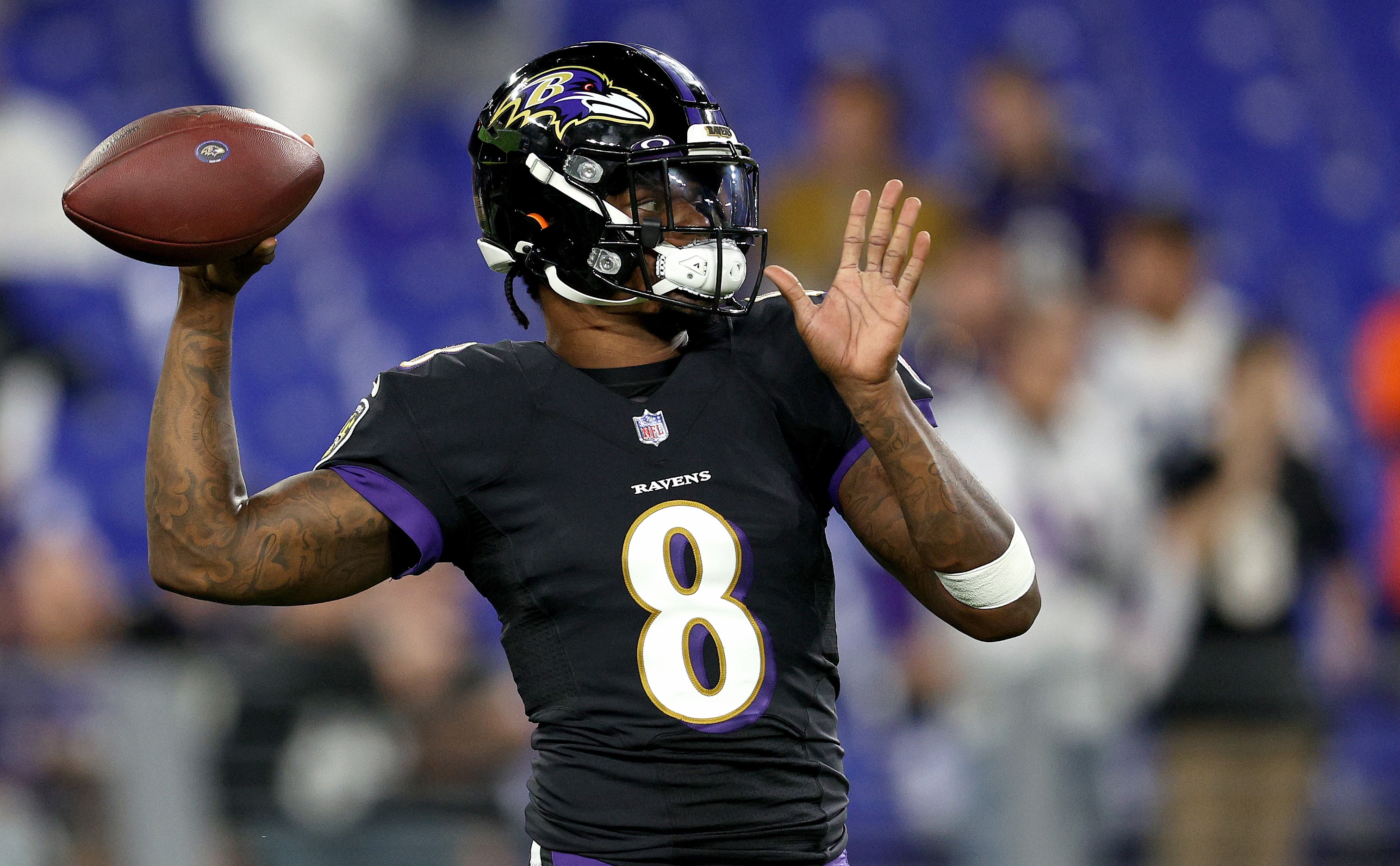 BALTIMORE, MARYLAND - OCTOBER 11: Lamar Jackson #8 of the Baltimore Ravens warms up before a game  against the Indianapolis Colts at M&T Bank Stadium on October 11, 2021 in Baltimore, Maryland. (Photo by Patrick Smith/Getty Images)