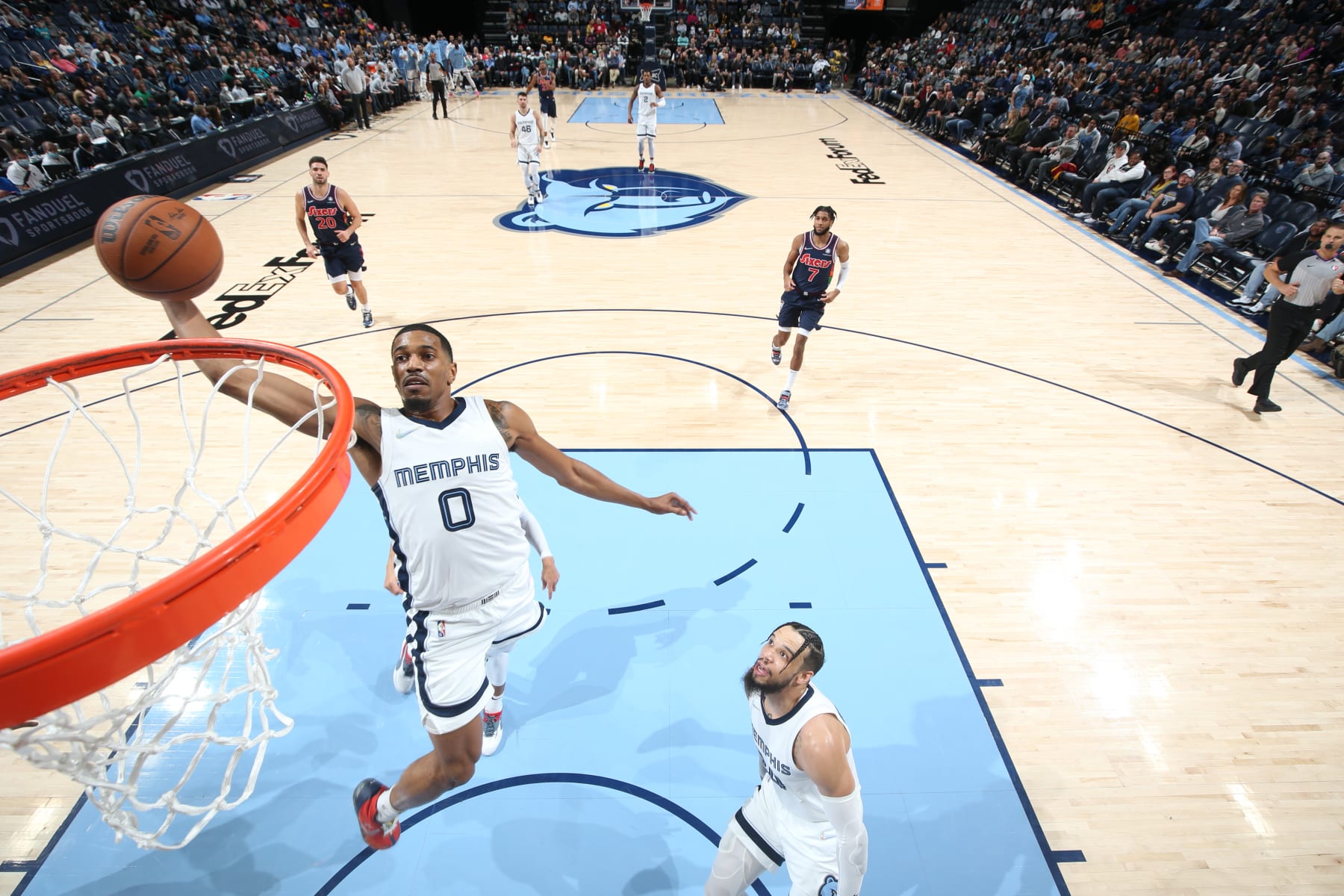 MEMPHIS, TN - DECEMBER 13: De'Anthony Melton #0 of the Memphis Grizzlies dunks the ball during the game against the Philadelphia 76ers on December 13, 2021 at FedExForum in Memphis, Tennessee. NOTE TO USER: User expressly acknowledges and agrees that, by downloading and or using this photograph, User is consenting to the terms and conditions of the Getty Images License Agreement. Mandatory Copyright Notice: Copyright 2021 NBAE (Photo by Joe Murphy/NBAE via Getty Images)