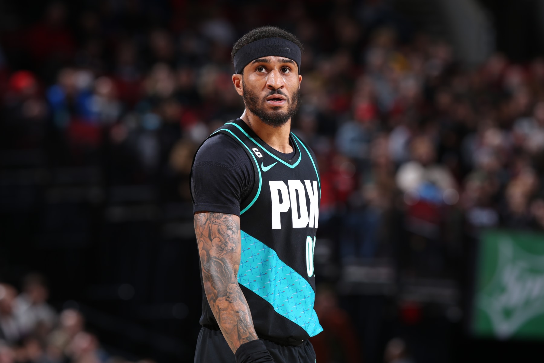 PORTLAND, OR - JANUARY 10:  Gary Payton II #00 of the Portland Trail Blazers looks on during the game against the Orlando Magic on January 10, 2023 at the Moda Center Arena in Portland, Oregon. NOTE TO USER: User expressly acknowledges and agrees that, by downloading and or using this photograph, user is consenting to the terms and conditions of the Getty Images License Agreement. Mandatory Copyright Notice: Copyright 2023 NBAE (Photo by Sam Forencich/NBAE via Getty Images)