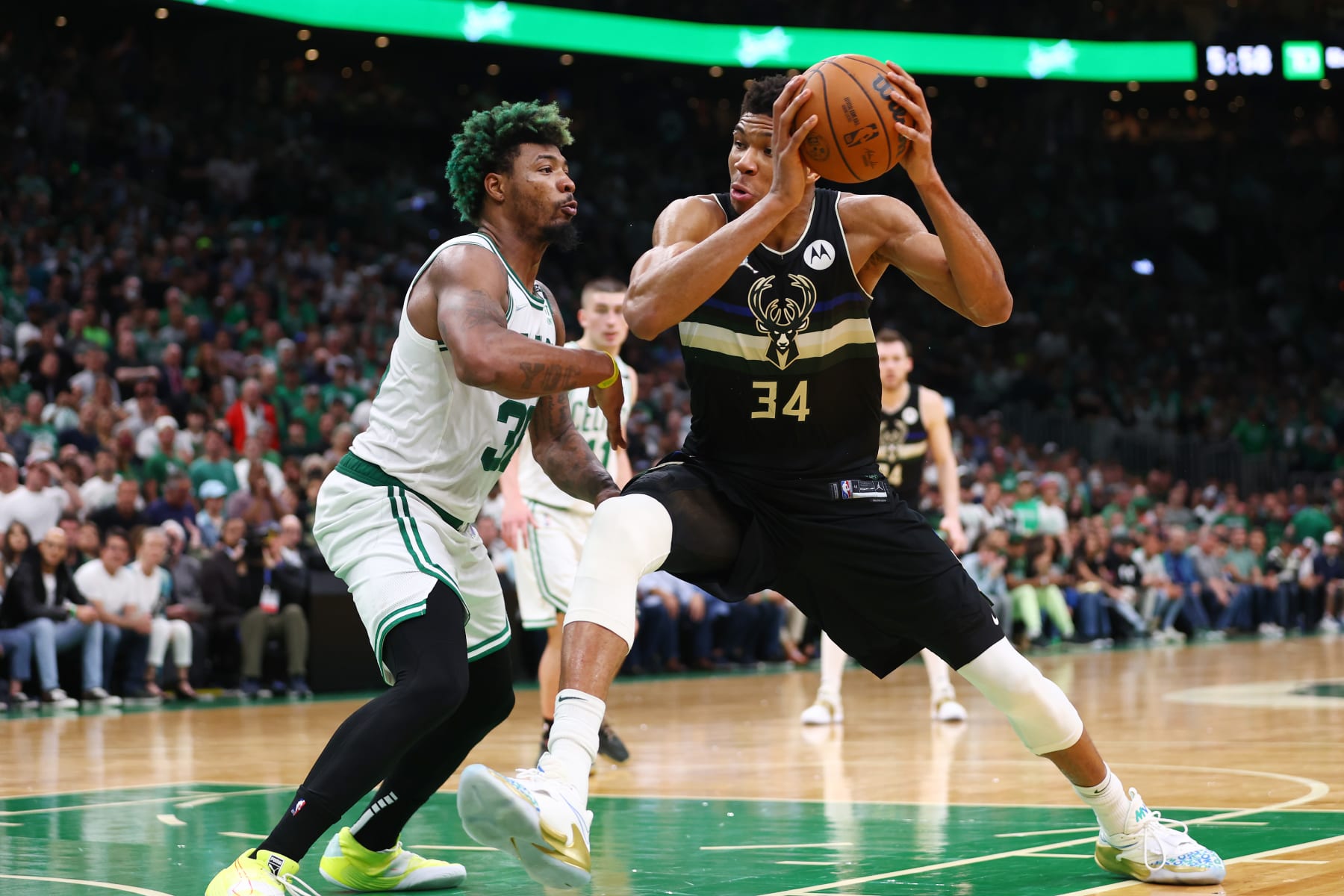 BOSTON, MASSACHUSETTS - MAY 15: Giannis Antetokounmpo #34 of the Milwaukee Bucks drives to the basket against Marcus Smart #36 of the Boston Celtics during the fourth quarter in Game Seven of the 2022 NBA Playoffs Eastern Conference Semifinals at TD Garden on May 15, 2022 in Boston, Massachusetts. NOTE TO USER: User expressly acknowledges and agrees that, by downloading and/or using this photograph, User is consenting to the terms and conditions of the Getty Images License Agreement. (Photo by Adam Glanzman/Getty Images) BOSTON, MASSACHUSETTS - MAY 15: Giannis Antetokounmpo #34 of the Milwaukee Bucks drives to the basket against Marcus Smart #36 of the Boston Celtics during the fourth quarter in Game Seven of the 2022 NBA Playoffs Eastern Conference Semifinals at TD Garden on May 15, 2022 in Boston, Massachusetts. NOTE TO USER: User expressly acknowledges and agrees that, by downloading and/or using this photograph, User is consenting to the terms and conditions of the Getty Images License Agreement. (Photo by Adam Glanzman/Getty Images)