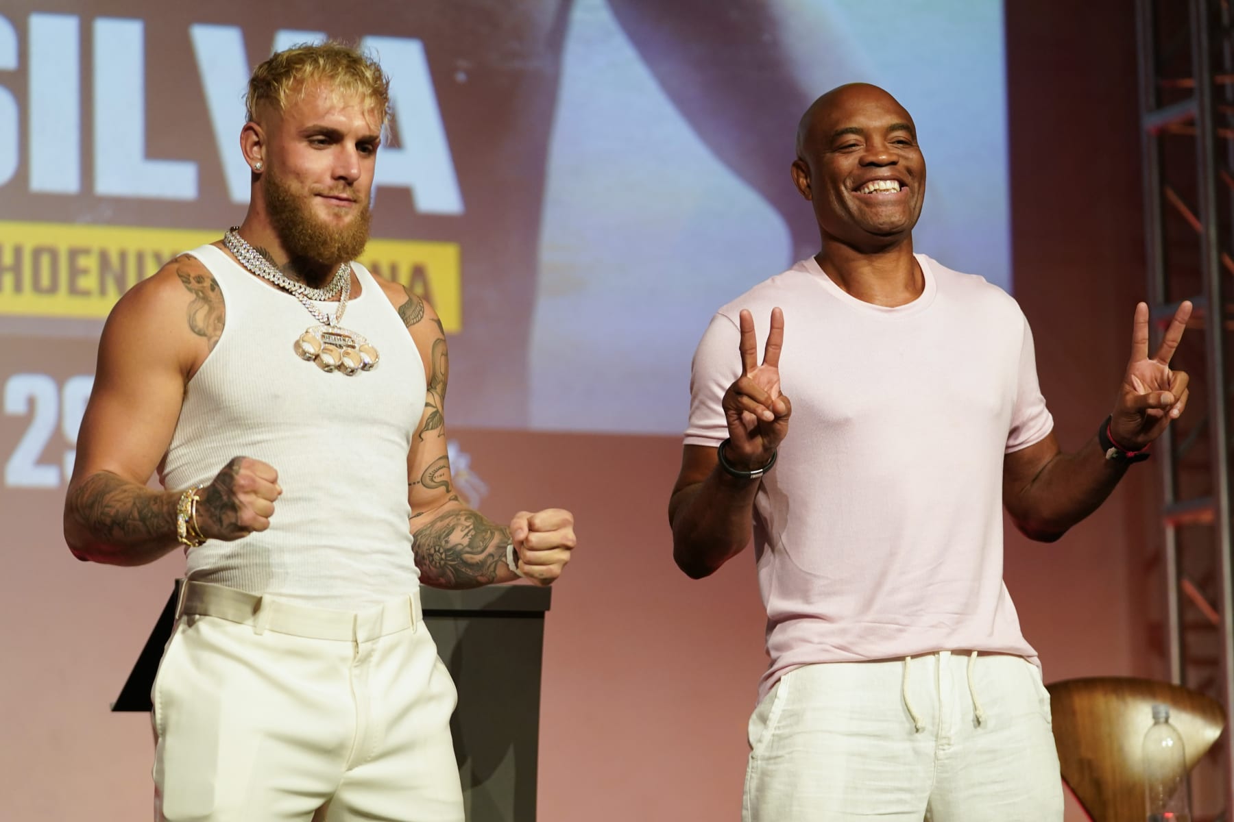 Jake Paul, left, and Anderson Silva pose for photos during a news conference Monday, Sept. 12, 2022, in Los Angeles. The two are scheduled to fight at a catchweight of 187 pounds on Oct. 29 in Phoenix. (AP Photo/Ashley Landis)