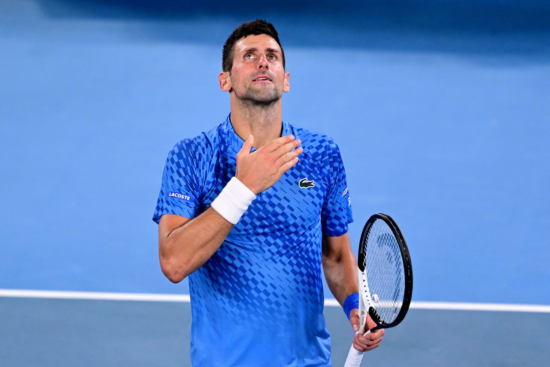 Serbia's Novak Djokovic celebrates victory against Tommy Paul of the US after the men's singles semi-final match on day twelve of the Australian Open tennis tournament in Melbourne on January 27, 2023. - -- IMAGE RESTRICTED TO EDITORIAL USE - STRICTLY NO COMMERCIAL USE -- (Photo by Manan VATSYAYANA / AFP) / -- IMAGE RESTRICTED TO EDITORIAL USE - STRICTLY NO COMMERCIAL USE -- (Photo by MANAN VATSYAYANA/AFP via Getty Images)