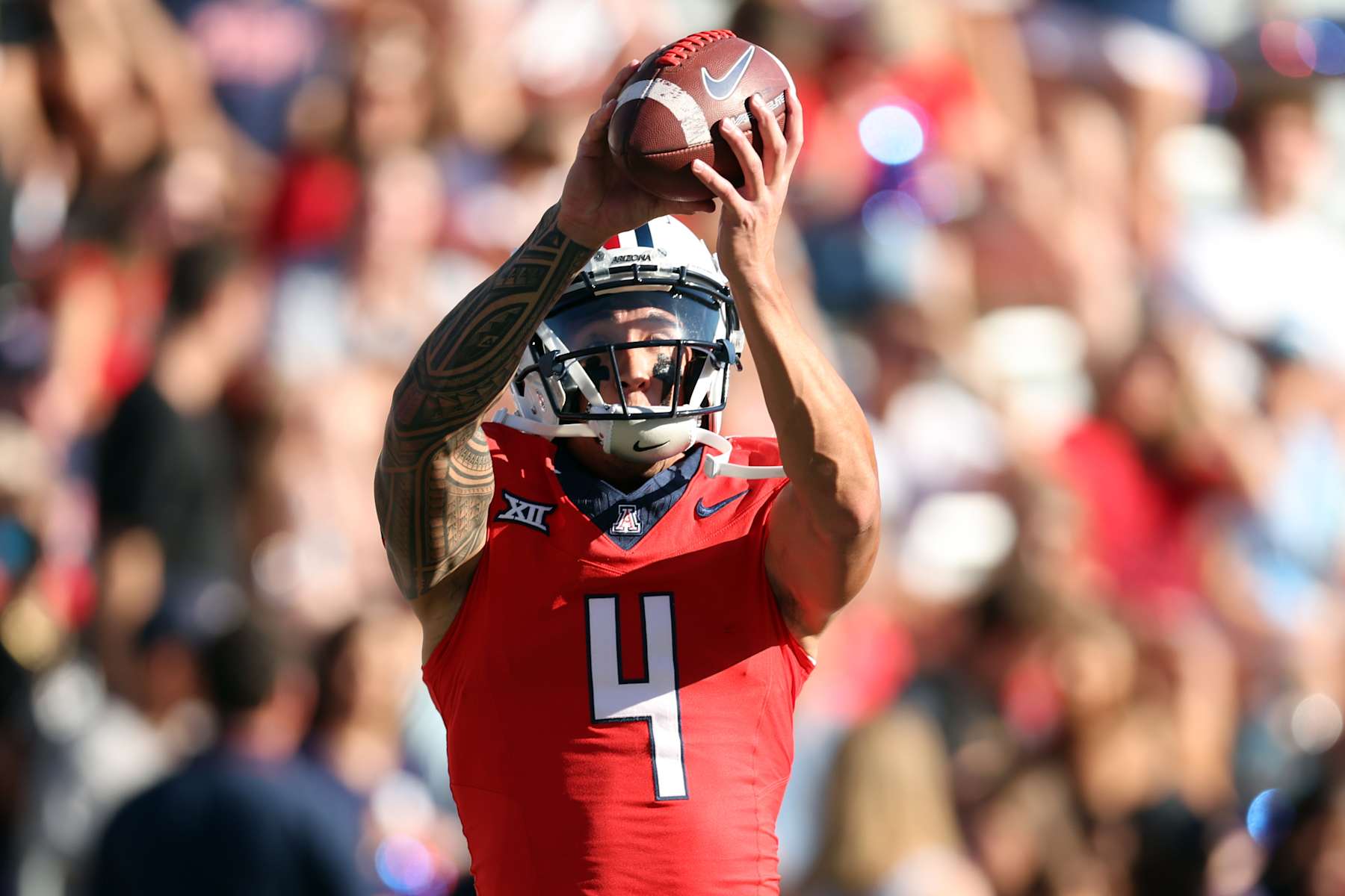 TUCSON, ARIZONA - OCTOBER 26: Wide receiver Tetairoa McMillan #4 of the Arizona Wildcats warms up before the game against the West Virginia Mountaineers at Arizona Stadium on October 26, 2024 in Tucson, Arizona. (Photo by Chris Coduto/Getty Images)
