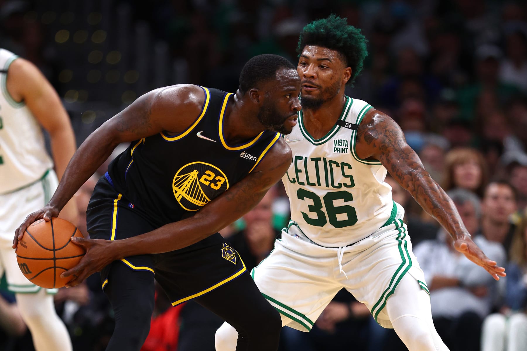 BOSTON, MASSACHUSETTS - JUNE 10: Draymond Green #23 of the Golden State Warriors looks to pass the ball defended by Marcus Smart #36 of the Boston Celtics in the first quarter during Game Four of the 2022 NBA Finals at TD Garden on June 10, 2022 in Boston, Massachusetts. NOTE TO USER: User expressly acknowledges and agrees that, by downloading and/or using this photograph, User is consenting to the terms and conditions of the Getty Images License Agreement. (Photo by Elsa/Getty Images)