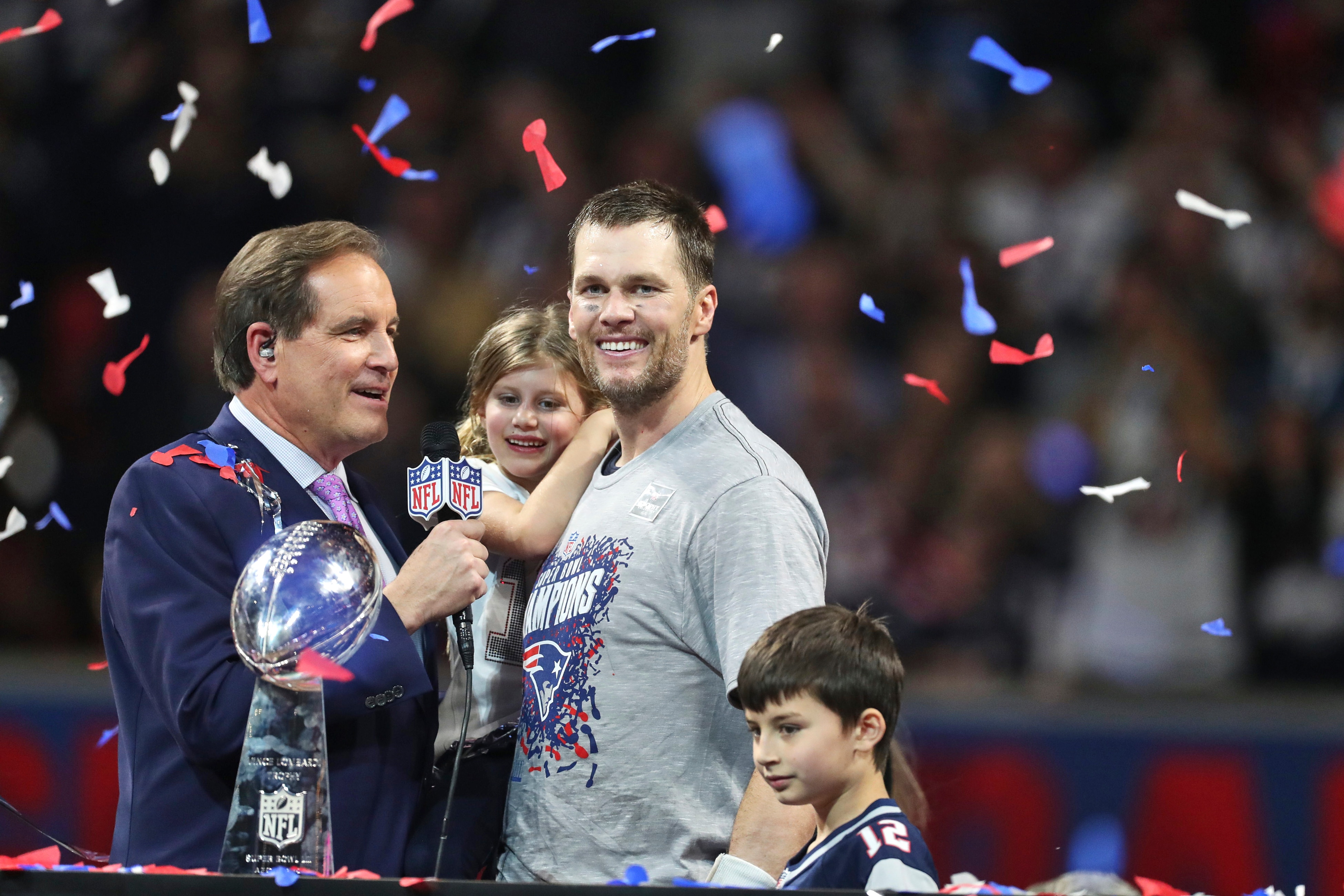 Football: Super Bowl LIII: New England Patriots QB Tom Brady (12) victorious with his daughter Vivian and son Benjamin while speaking with CBS broadcaster Jim Nantz on podium after winning game vs Los Angeles Rams game at Mercedes-Benz Stadium. View of Vince Lombardi Trophy.
Atlanta, GA 2/3/2019
CREDIT: Simon Bruty (Photo by Simon Bruty /Sports Illustrated via Getty Images)
(Set Number: X162457 TK1 ) Football: Super Bowl LIII: New England Patriots QB Tom Brady (12) victorious with his daughter Vivian and son Benjamin while speaking with CBS broadcaster Jim Nantz on podium after winning game vs Los Angeles Rams game at Mercedes-Benz Stadium. View of Vince Lombardi Trophy.
Atlanta, GA 2/3/2019
CREDIT: Simon Bruty (Photo by Simon Bruty /Sports Illustrated via Getty Images)
(Set Number: X162457 TK1 )