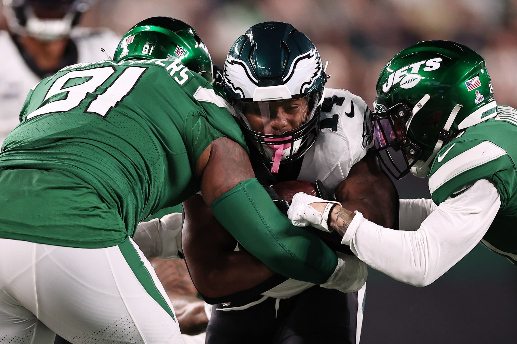 EAST RUTHERFORD, NEW JERSEY - OCTOBER 15: Kenneth Gainwell #14 of the Philadelphia Eagles is tackled by John Franklin-Myers #91 of the New York Jets during the second half at MetLife Stadium on October 15, 2023 in East Rutherford, New Jersey. (Photo by Dustin Satloff/Getty Images)