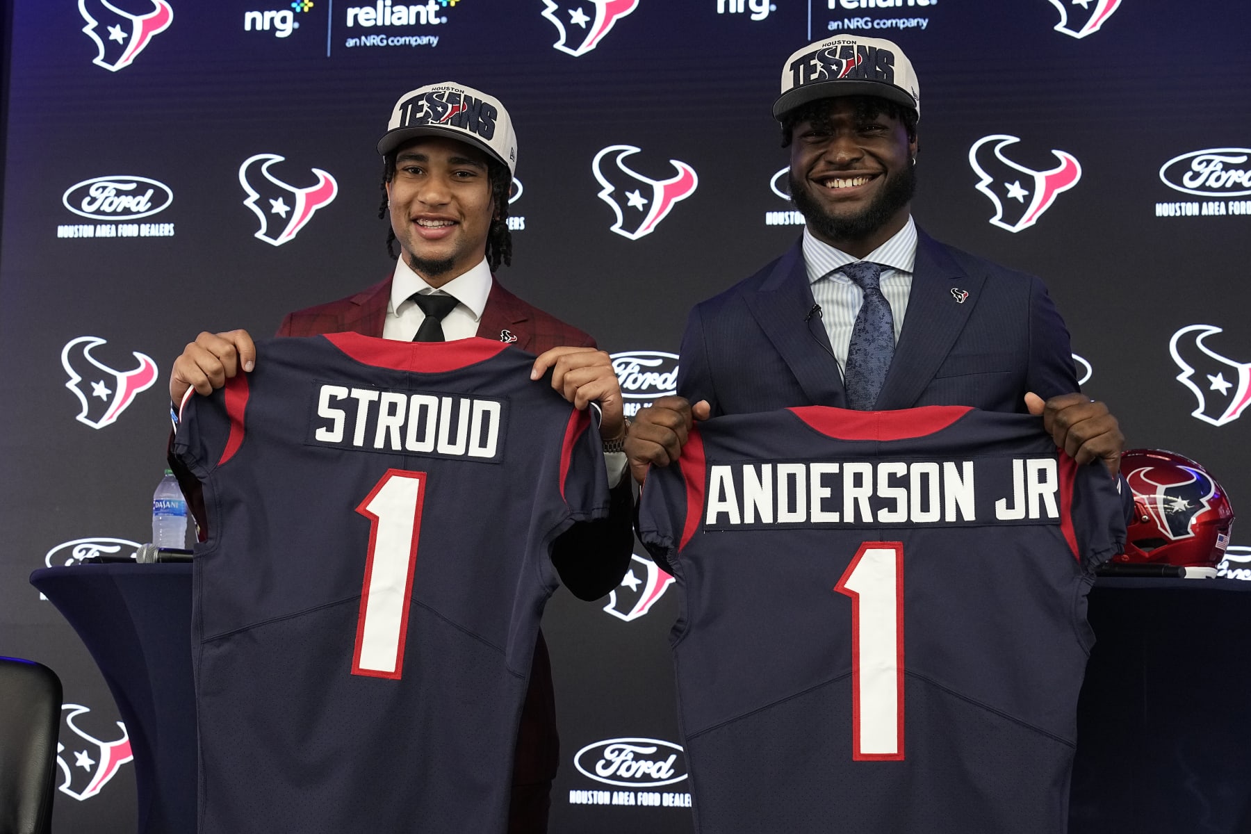 Houston Texans first round draft picks quarterback C.J. Stroud, left, and linebacker Will Anderson Jr. hold up jerseys during an introductory NFL football press conference, Friday, April 28, 2023, in Houston.. (AP Photo/Kevin M. Cox)