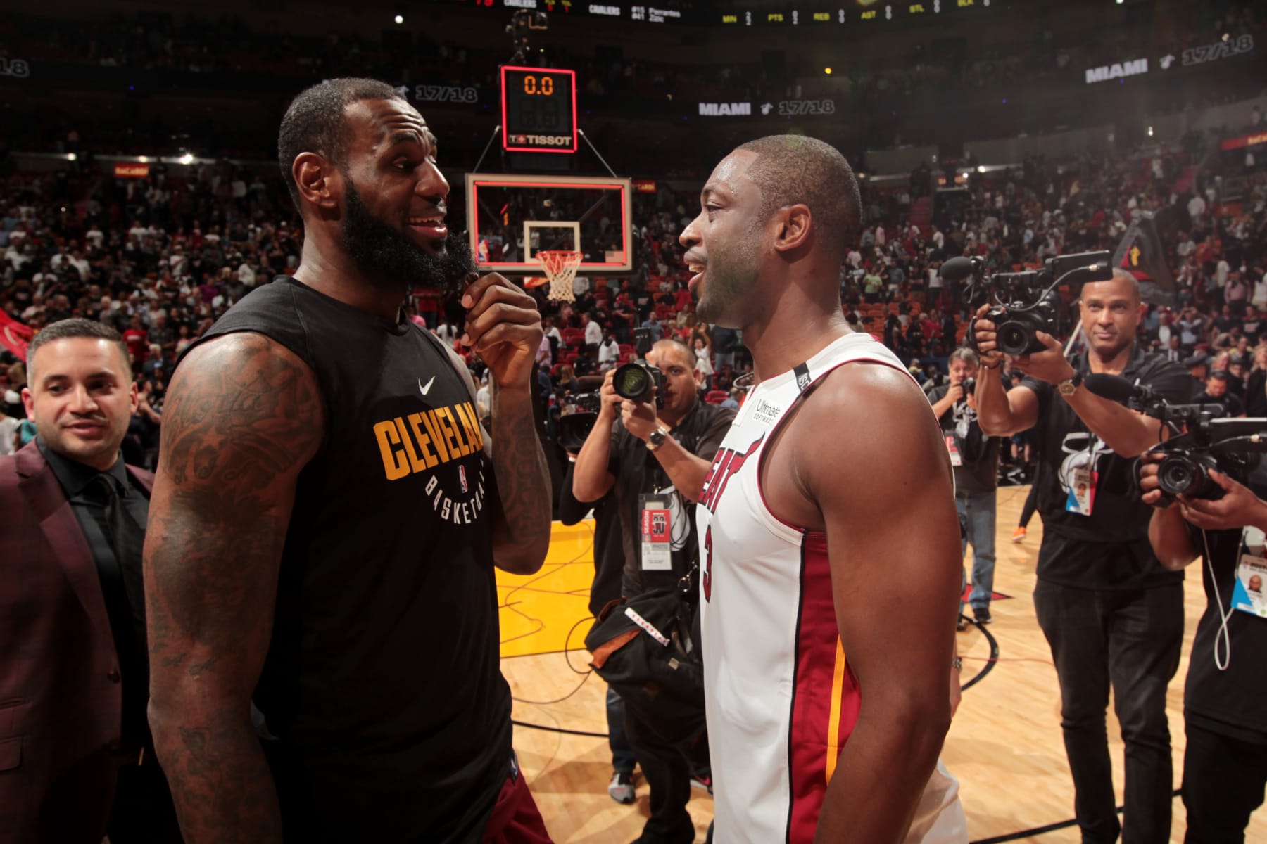 MIAMI, FL - MARCH 27:  LeBron James #23 of the Cleveland Cavaliers and Dwyane Wade #3 of the Miami Heat meet after the game between the two teams on March 27, 2018 at American Airlines Arena in Miami, Florida. NOTE TO USER: User expressly acknowledges and agrees that, by downloading and or using this Photograph, user is consenting to the terms and conditions of the Getty Images License Agreement. Mandatory Copyright Notice: Copyright 2018 NBAE (Photo by Oscar Baldizon/NBAE via Getty Images)