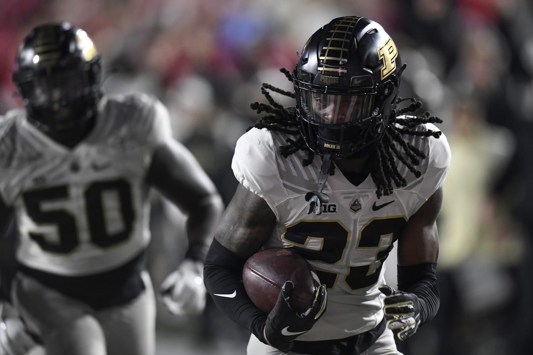 BLOOMINGTON, IN - NOVEMBER 26: Purdue Boilermakers cornerback Cory Trice (23) returns a stripped ball for a touchdown during the college football game between the Purdue Boilermakers and the Indiana Hoosiers on November 26, 2022, at Memorial Stadium in Bloomington, Indiana. (Photo by Michael Allio/Icon Sportswire via Getty Images)