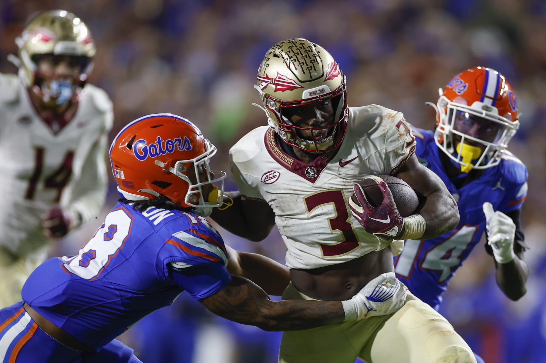 GAINESVILLE, FL - NOVEMBER 25: Florida State Seminoles running back Trey Benson (3) runs with the ball during the game between the Florida Gators and the Florida State Seminoles on November 25, 2023 at Ben Hill Griffin Stadium at Florida Field in Gainesville, Fl. (Photo by David Rosenblum/Icon Sportswire via Getty Images)
