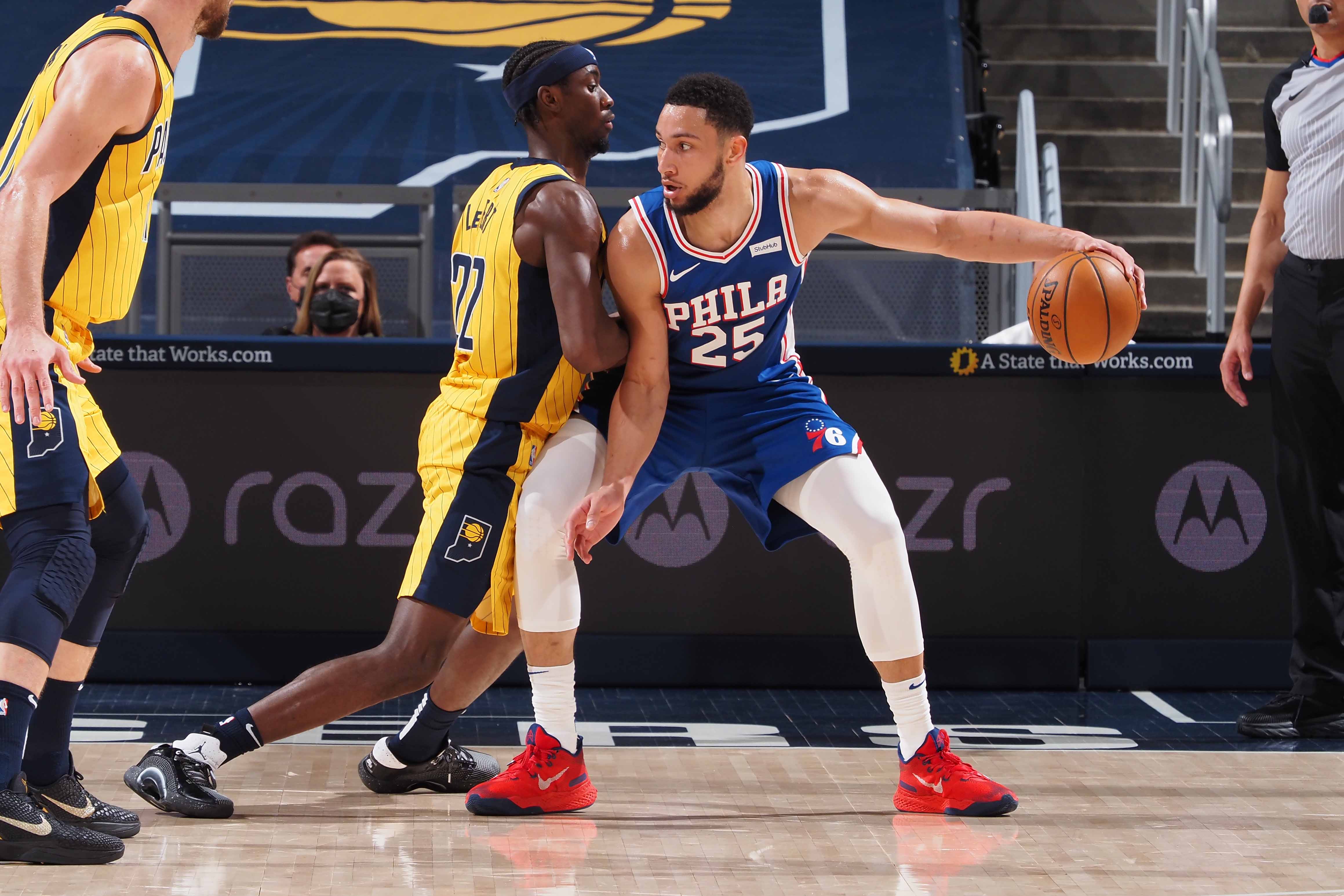 INDIANAPOLIS, IN - MAY 11: Caris LeVert #22 of the Indiana Pacers plays defense on Ben Simmons #25 of the Philadelphia 76ers during the game on May 11, 2021 at Bankers Life Fieldhouse in Indianapolis, Indiana. NOTE TO USER: User expressly acknowledges and agrees that, by downloading and or using this Photograph, user is consenting to the terms and conditions of the Getty Images License Agreement. Mandatory Copyright Notice: Copyright 2021 NBAE (Photo by Ron Hoskins/NBAE via Getty Images)