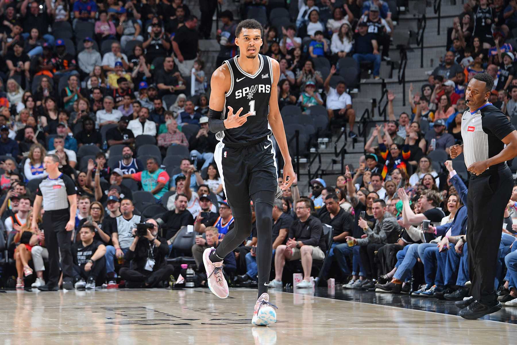 SAN ANTONIO, TX - MARCH 29: Victor Wembanyama #1 of the San Antonio Spurs celebrates three point basket during the game against the New York Knicks on March 29, 2024 at the Frost Bank Center in San Antonio, Texas. NOTE TO USER: User expressly acknowledges and agrees that, by downloading and or using this photograph, user is consenting to the terms and conditions of the Getty Images License Agreement. Mandatory Copyright Notice: Copyright 2024 NBAE (Photos by Michael Gonzales/NBAE via Getty Images)
