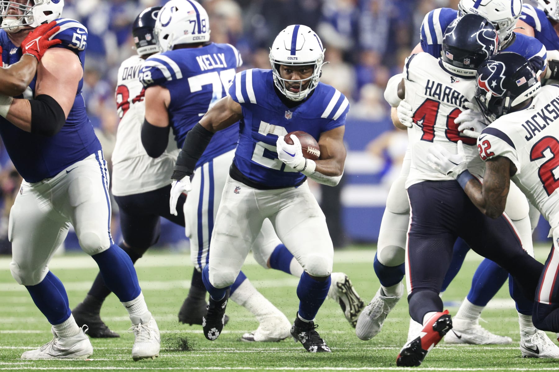 INDIANAPOLIS, INDIANA - JANUARY 06: Zack Moss #21 of the Indianapolis Colts runs with the ball during the fourth quarter against the Houston Texans at Lucas Oil Stadium on January 06, 2024 in Indianapolis, Indiana. (Photo by Michael Hickey/Getty Images)
