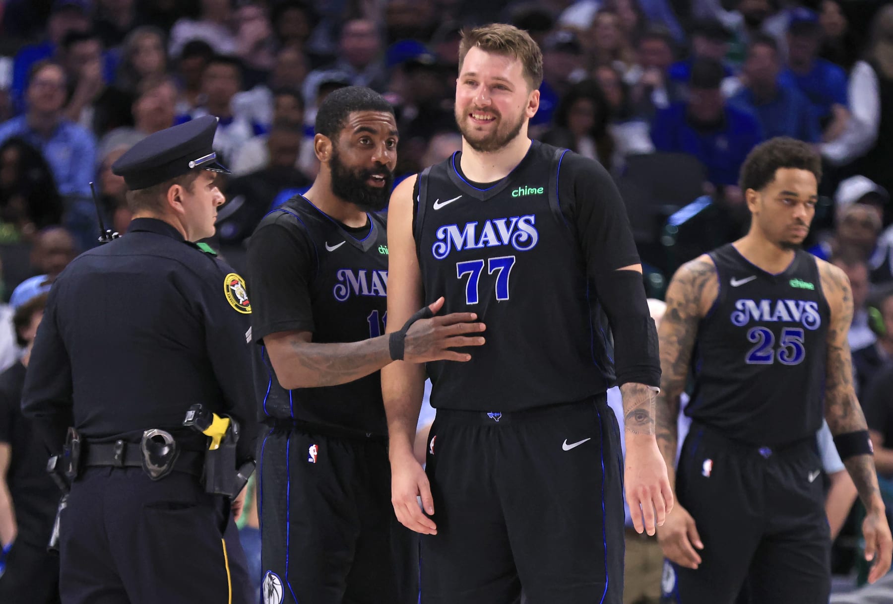 DALLAS, TX - FEBRUARY 22: Kyrie Irving #11 of the Dallas Mavericks and teammate Luka Doncic #77 react after a basket against the Phoenix Suns in the second half at American Airlines Center on February 22, 2024 in Dallas, Texas. NOTE TO USER: User expressly acknowledges and agrees that, by downloading and or using this photograph, User is consenting to the terms and conditions of the Getty Images License Agreement. (Photo by Ron Jenkins/Getty Images)