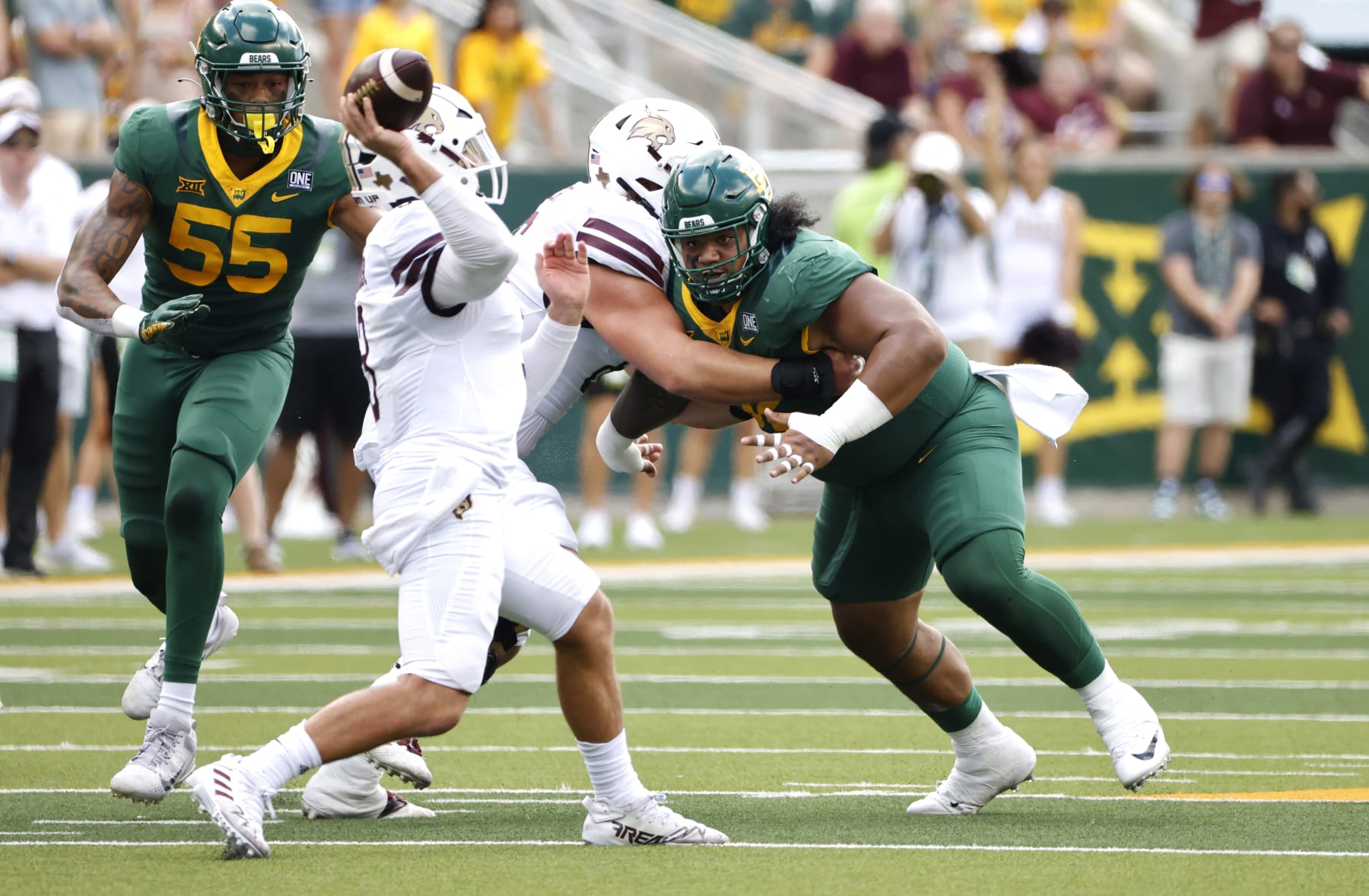 WACO, TX - SEPTEMBER 17: Siaki Ika #62 of the Baylor Bears pressures Layne Hatcher #3 of the Texas State Bobcats in the first half at McLane Stadium on September 17, 2022 in Waco, Texas. (Photo by Ron Jenkins/Getty Images)