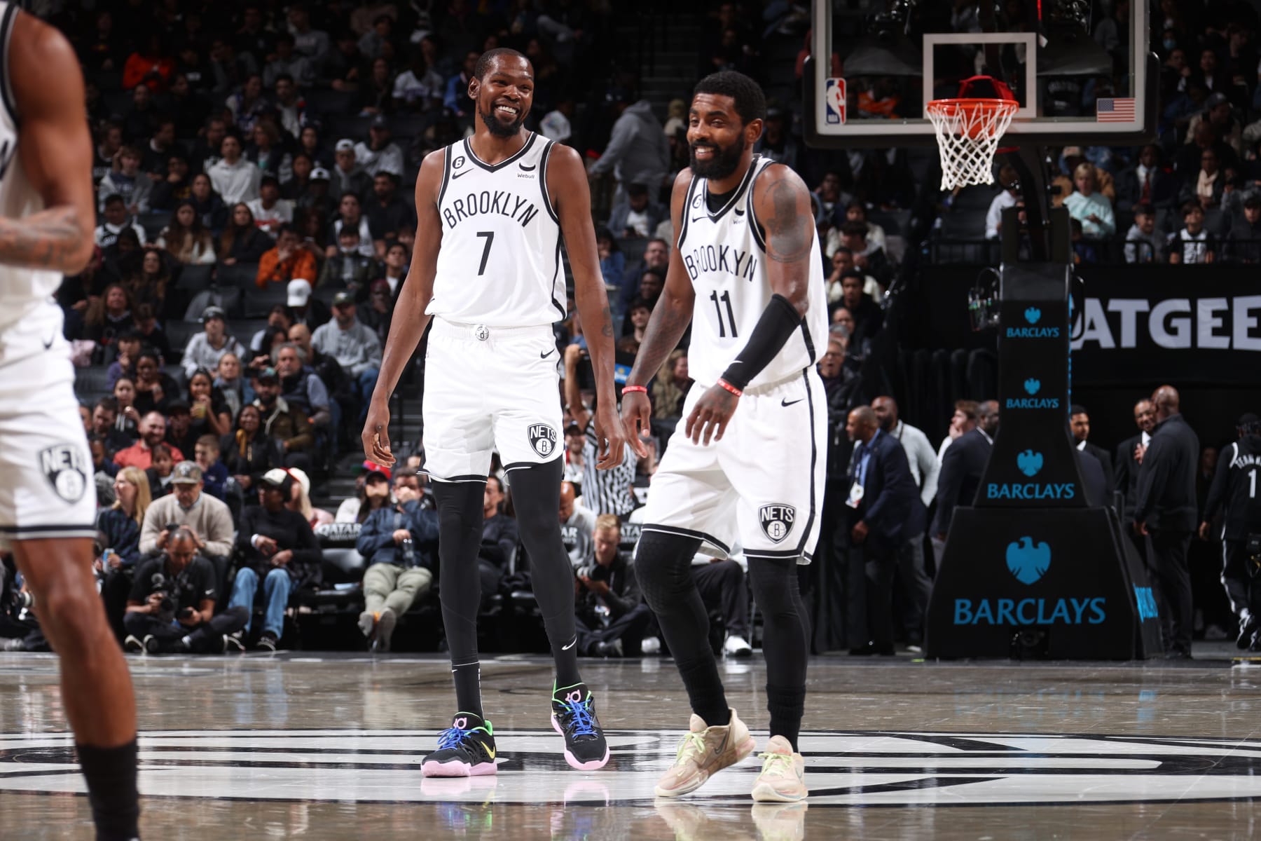 BROOKLYN, NY - OCTOBER 3: Kevin Durant #7 and Kyrie Irving #11 of the Brooklyn Nets smile during a preseason game on against the Philadelphia 76ers October 3, 2022 at Barclays Center in Brooklyn, New York. NOTE TO USER: User expressly acknowledges and agrees that, by downloading and or using this Photograph, user is consenting to the terms and conditions of the Getty Images License Agreement. Mandatory Copyright Notice: Copyright 2022 NBAE (Photo by Nathaniel S. Butler/NBAE via Getty Images)
