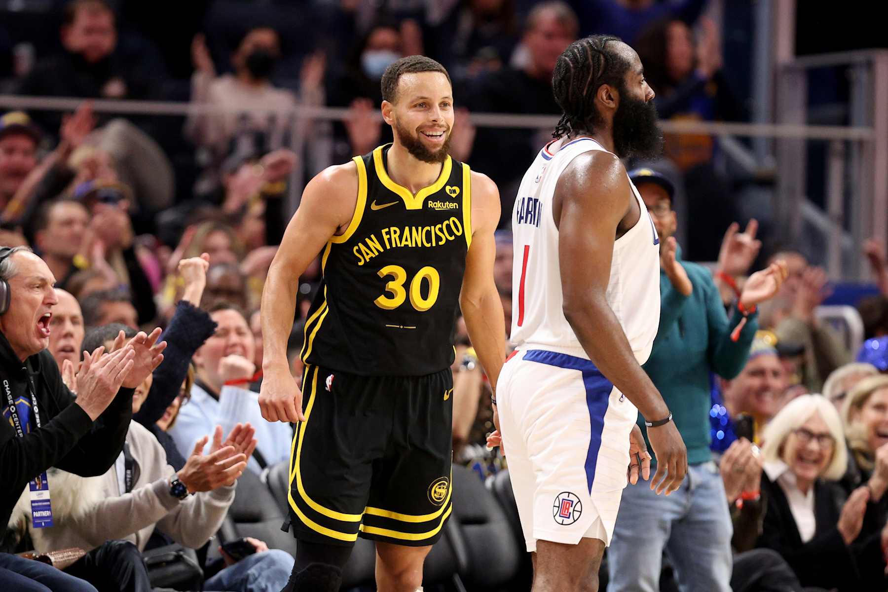 SAN FRANCISCO, CALIFORNIA - FEBRUARY 14: Stephen Curry #30 of the Golden State Warriors reacts after he made a three-point basket on James Harden #1 of the LA Clippers at Chase Center on February 14, 2024 in San Francisco, California. NOTE TO USER: User expressly acknowledges and agrees that, by downloading and or using this photograph, User is consenting to the terms and conditions of the Getty Images License Agreement.  (Photo by Ezra Shaw/Getty Images)