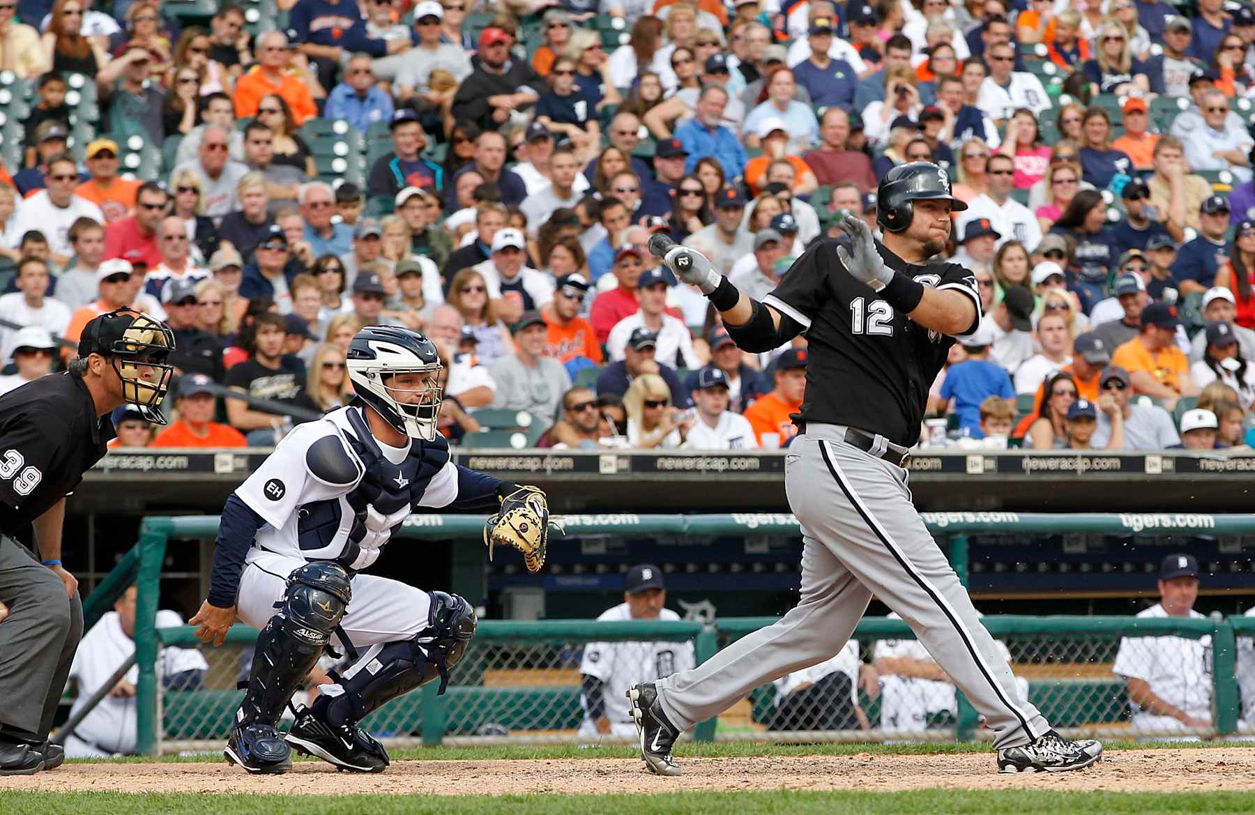 DETROIT - SEPTEMBER 06: A. J. Pierzynski #12 of the Chicago White Sox singles in the tenth inning scoring Alejandro De Aza #30 to give the White Soxs a 5-4 lead over the Detroit Tigers on September 6, 2010 at Comerica Park in Detroit, Michigan.  (Photo by Leon Halip/Getty Images)