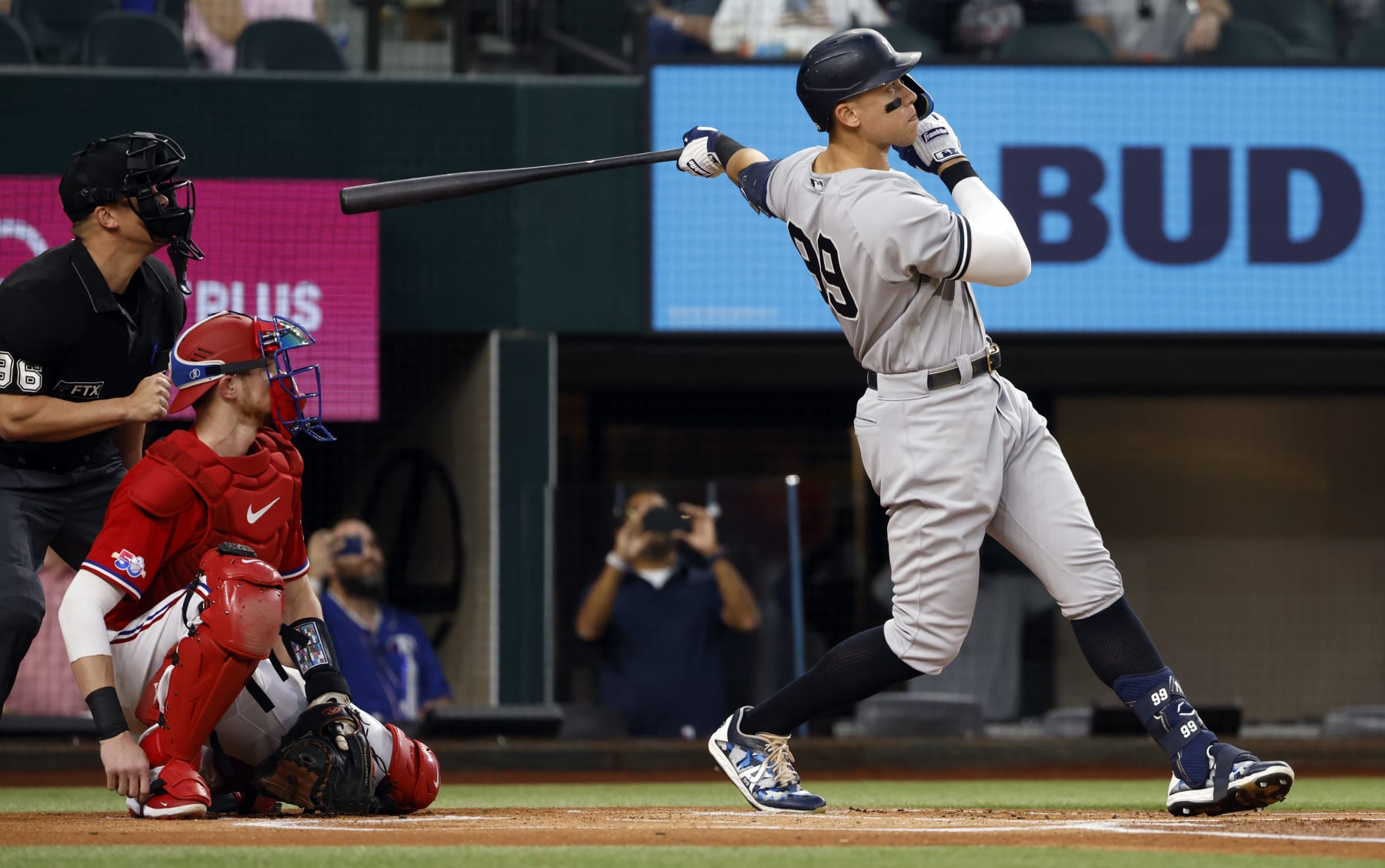 ARLINGTON, TX - OCTOBER 4: 
Aaron Judge #99 of the New York Yankees hits his 62nd home run of the season against the Texas Rangers during the first inning in game two of a double header at Globe Life Field on October 4, 2022 in Arlington, Texas. Judge has now set the American League record for home runs in a single season. (Photo by Ron Jenkins/Getty Images)