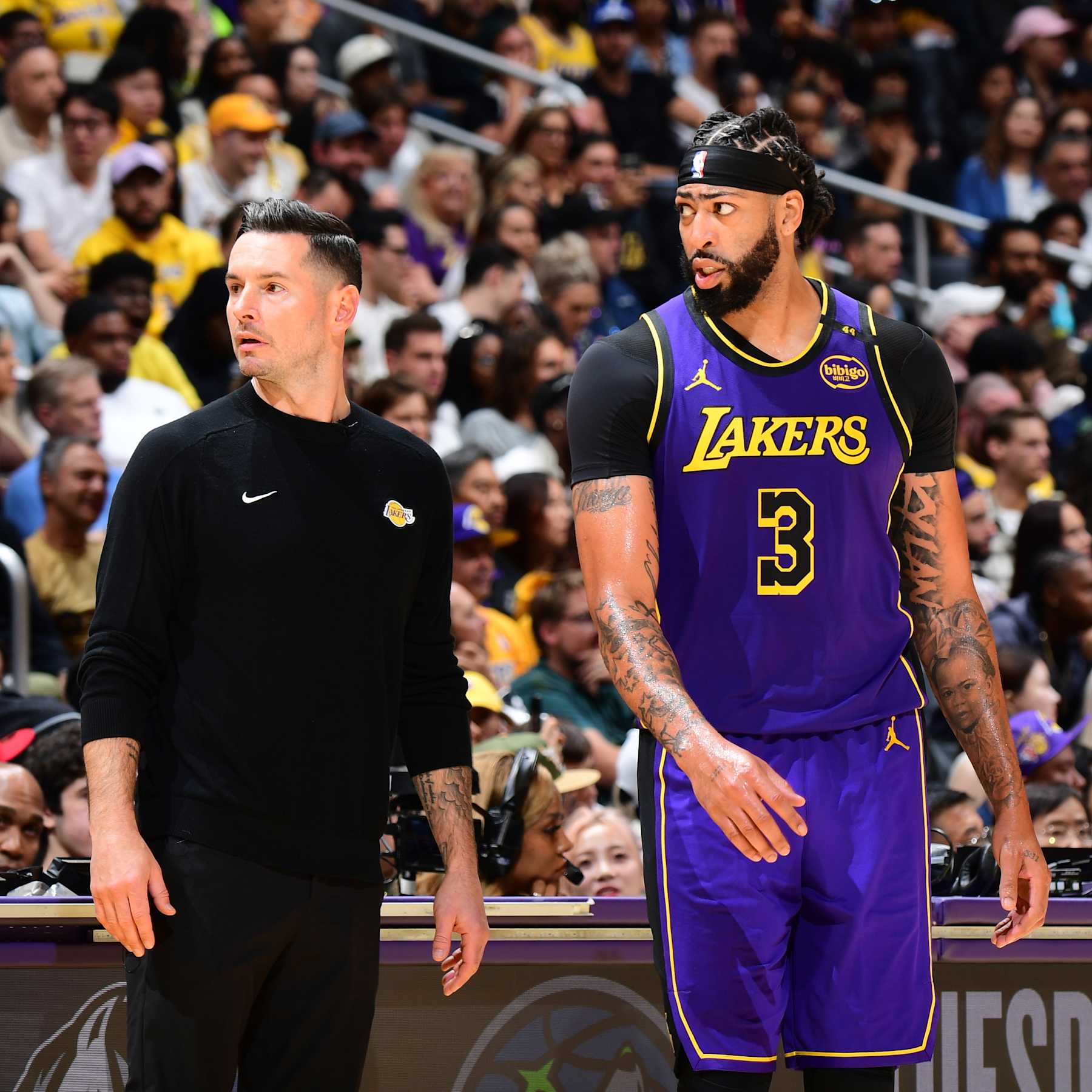 LOS ANGELES, CA - OCTOBER 25: Anthony Davis #3 and Head Coach JJ Redick of the Los Angeles Lakers looks on during the game Phoenix Suns on October 25, 2024 at Crypto.Com Arena in Los Angeles, California. NOTE TO USER: User expressly acknowledges and agrees that, by downloading and/or using this Photograph, user is consenting to the terms and conditions of the Getty Images License Agreement. Mandatory Copyright Notice: Copyright 2024 NBAE (Photo by Adam Pantozzi/NBAE via Getty Images)