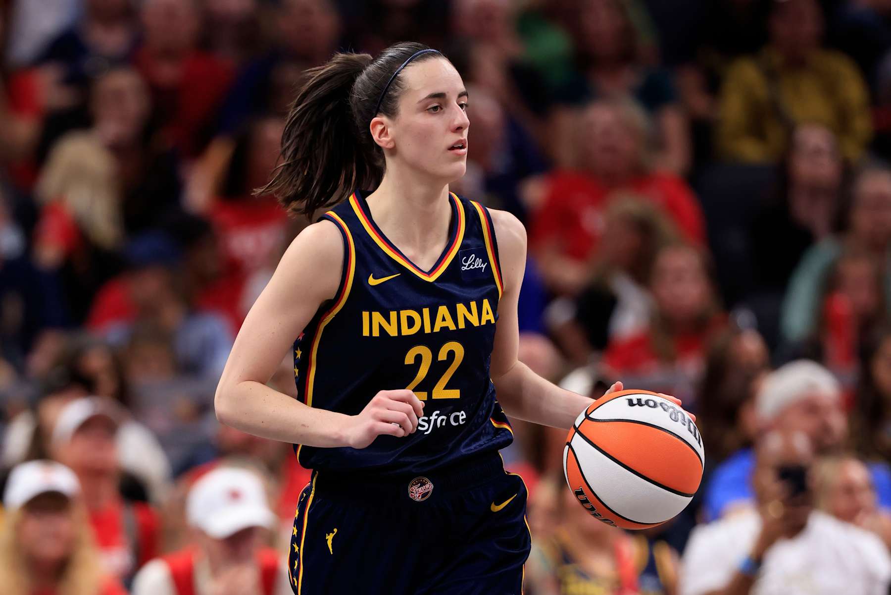 INDIANAPOLIS, INDIANA - SEPTEMBER 15: Caitlin Clark #22 of the Indiana Fever brings the ball up the court against the Dallas Wings at Gainbridge Fieldhouse on September 15, 2024 in Indianapolis, Indiana. NOTE TO USER: User expressly acknowledges and agrees that, by downloading and or using this photograph, User is consenting to the terms and conditions of the Getty Images License Agreement. (Photo by Justin Casterline/Getty Images)