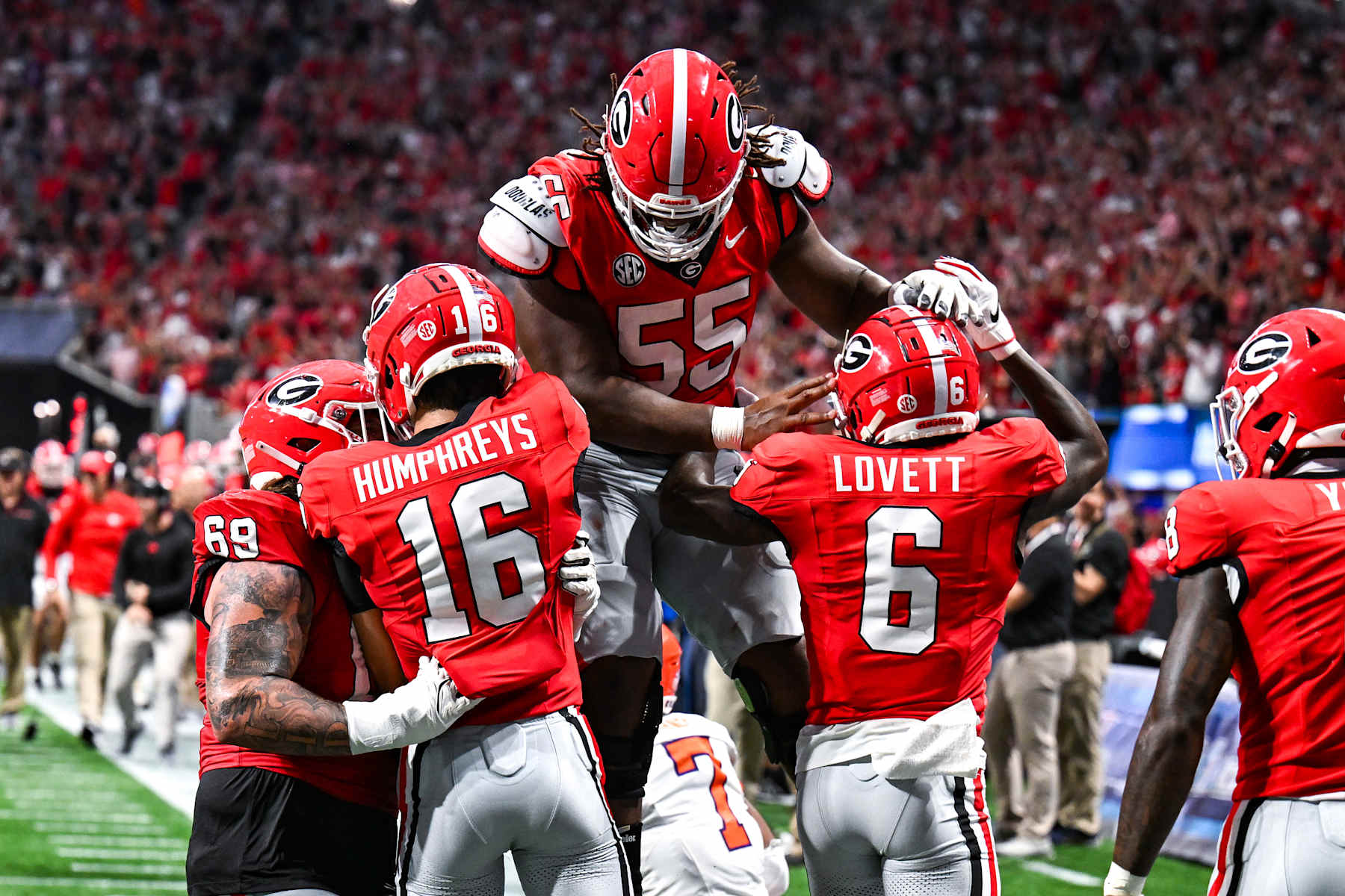 ATLANTA, GA  AUGUST 31:  Georgia offensive lineman Jared Wilson (55) celebrates after a touchdown by wide receiver London Humphreys (16) during the Aflac Kickoff Game between the Clemson Tigers and the Georgia Bulldogs on August 31st, 2024 at Mercedes-Benz Stadium in Atlanta, GA.  (Photo by Rich von Biberstein/Icon Sportswire via Getty Images)