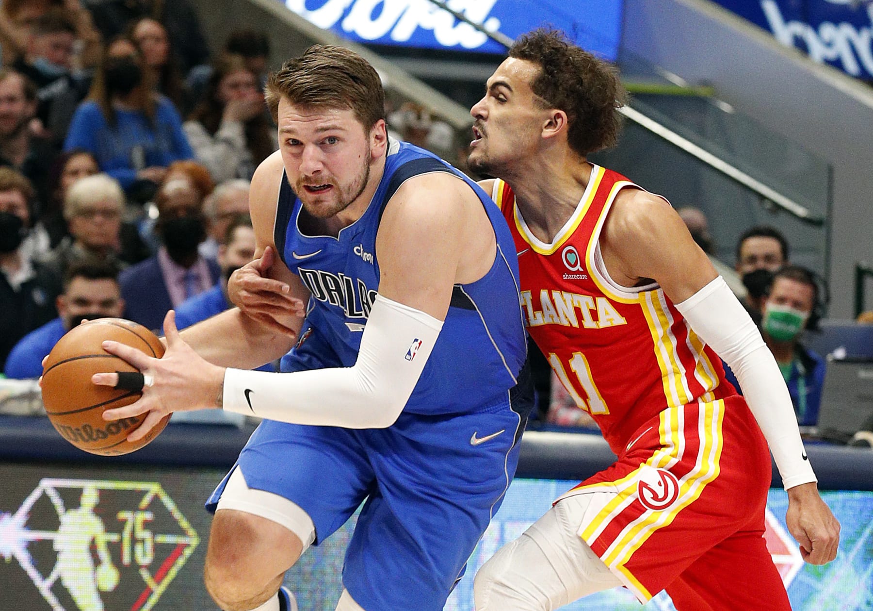 DALLAS, TEXAS - FEBRUARY 06: Luka Doncic #77 of the Dallas Mavericks drives against Trae Young #11 of the Atlanta Hawks in the first half at American Airlines Center on February 06, 2022 in Dallas, Texas. NOTE TO USER: User expressly acknowledges and agrees that, by downloading and or using this photograph, User is consenting to the terms and conditions of the Getty Images License Agreement. (Photo by Richard Rodriguez/Getty Images)
