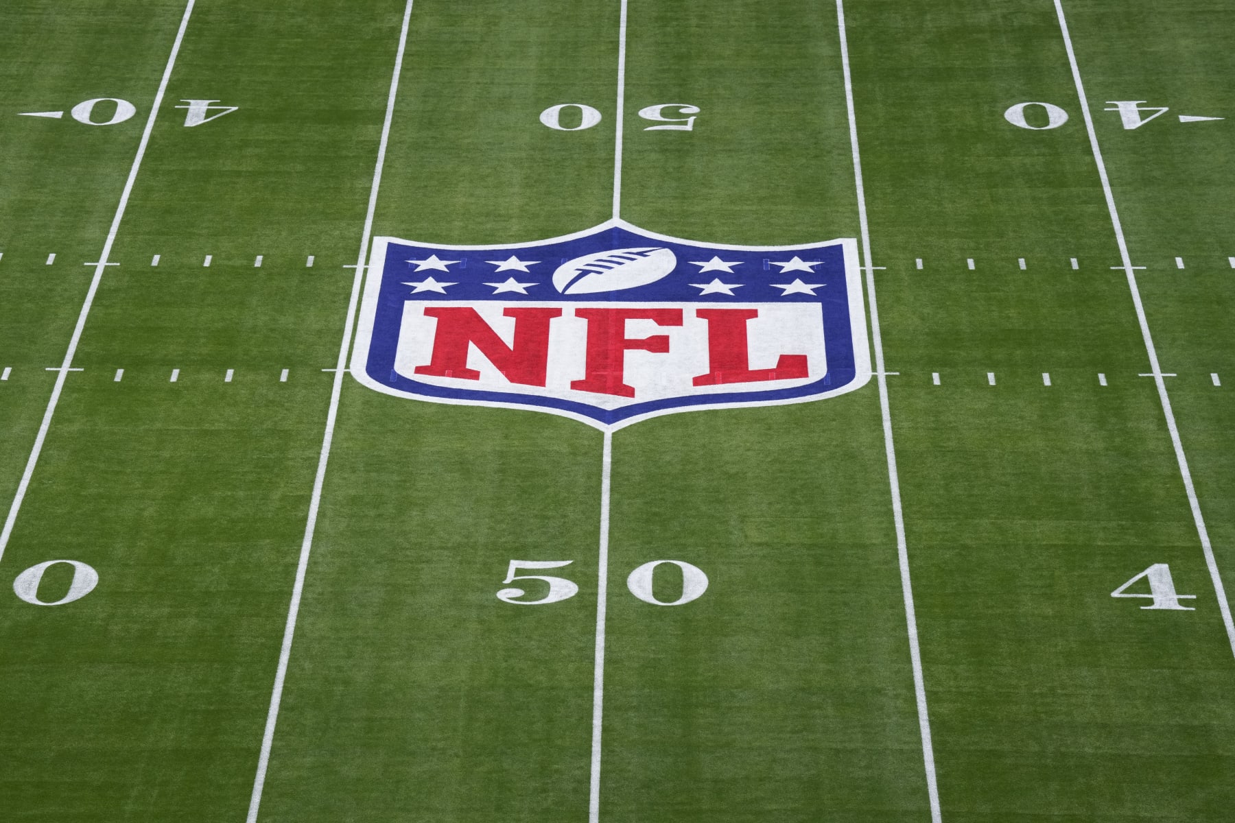 GLENDALE, AZ - FEBRUARY 12: Elevated view of the NFL Shield logo painted on the field prior to Super Bowl LVII between the Kansas City Chiefs and the Philadelphia Eagles at State Farm Stadium on February 12, 2023 in Glendale, Arizona. (Photo by Cooper Neill/Getty Images)