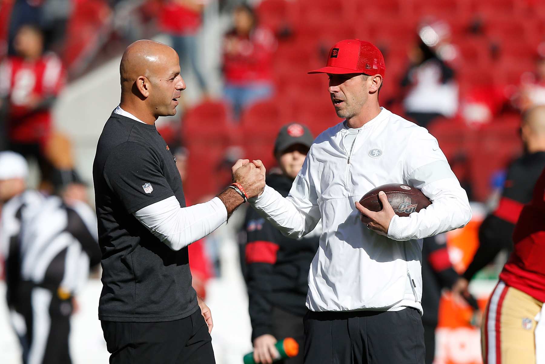 SANTA CLARA, CALIFORNIA - DECEMBER 15: Head coach Kyle Shanahan of the San Francisco 49ers talks to defensive co-ordinator Robert Saleh during the warm up before the game against the Atlanta Falcons at Levi's Stadium on December 15, 2019 in Santa Clara, California. (Photo by Lachlan Cunningham/Getty Images)