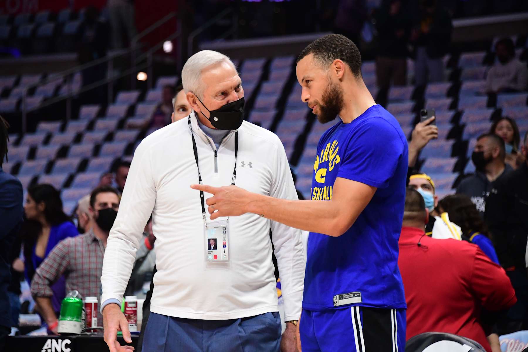 LOS ANGELES, CA - FEBRUARY 14: Stephen Curry #30 of the Golden State Warriors embraces NBA Legend, Jerry West before the game against the LA Clippers on February 14, 2022 at Crypto.Com Arena in Los Angeles, California. NOTE TO USER: User expressly acknowledges and agrees that, by downloading and/or using this Photograph, user is consenting to the terms and conditions of the Getty Images License Agreement. Mandatory Copyright Notice: Copyright 2022 NBAE (Photo by Adam Pantozzi/NBAE via Getty Images)